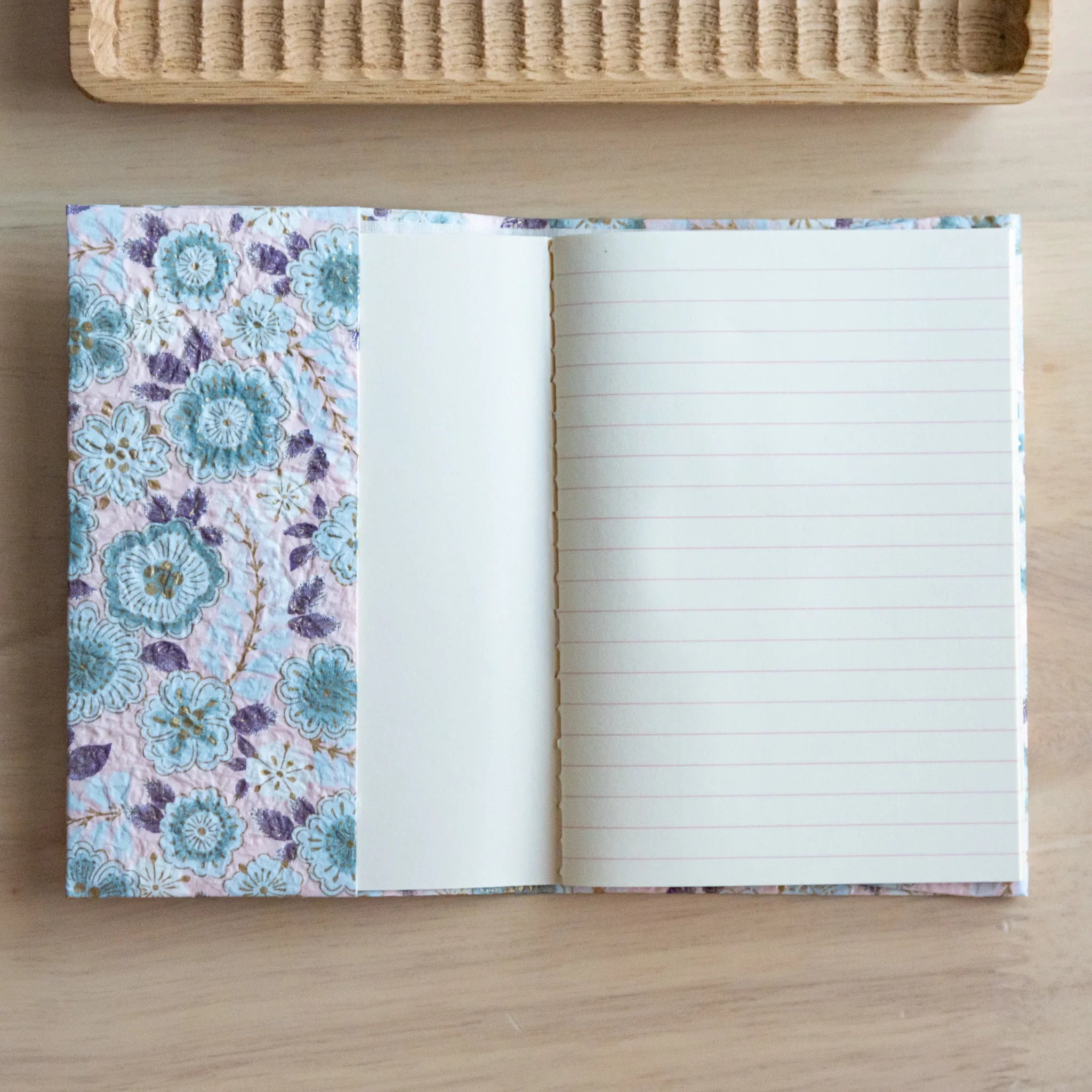 Pastel pink hand-dyed yuzen washi book cover A6, opened flat showing blank pages, showcase of ornate surface detail