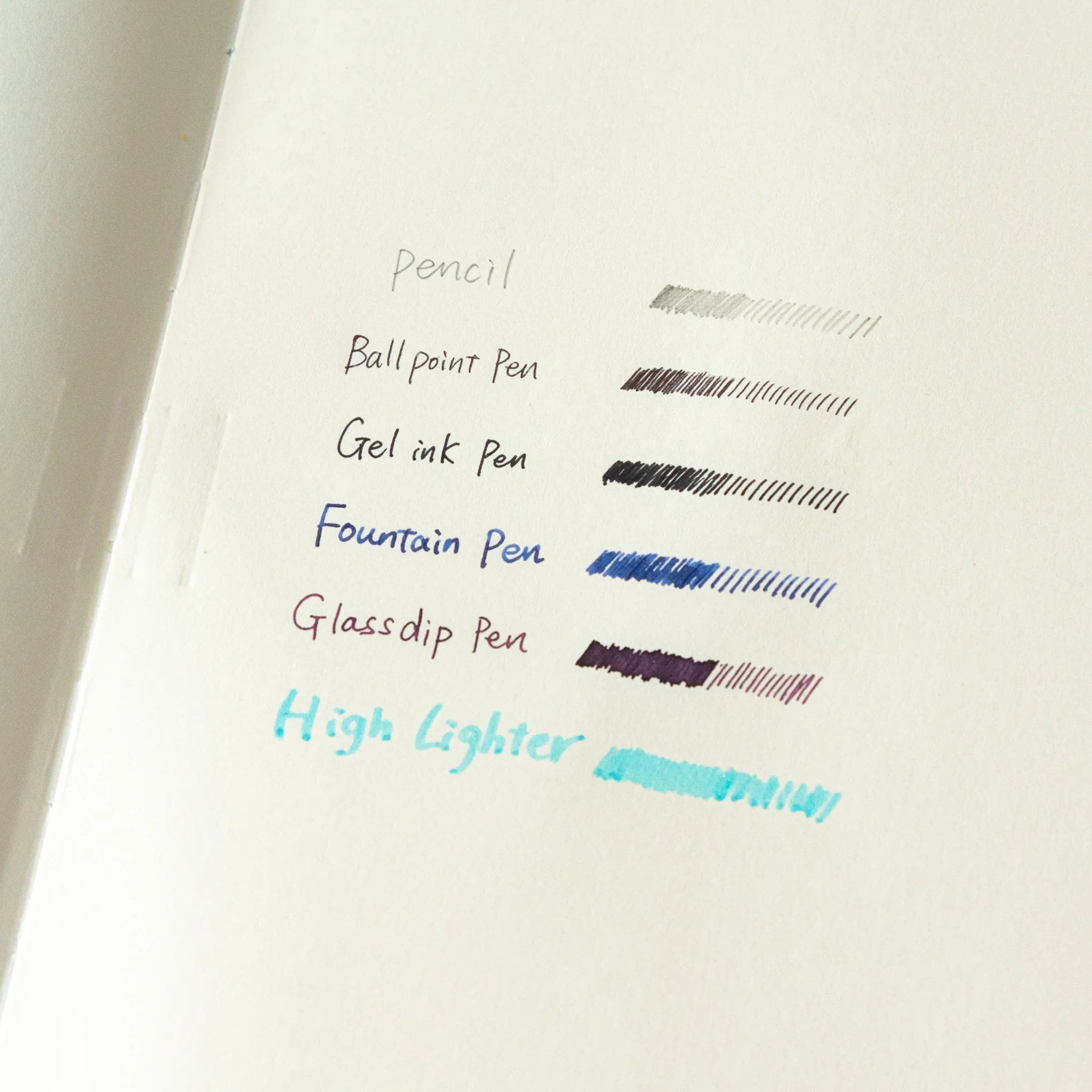 Apica Premium CD A5 cream notebook flat lay showing soft cover design with light blue interior pages and ruled lines