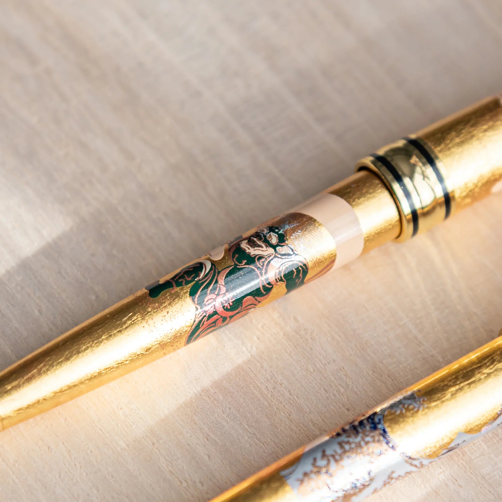 Gods of Wind and Thunder gold leaf ballpoint in professional presentation view shown in composition composition shown