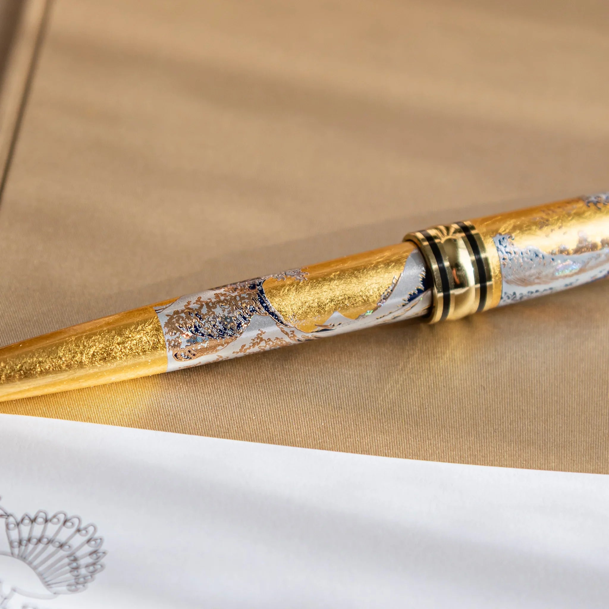 Gold Leaf Great Wave pen detail displaying Hokusai artwork and gold leaf decoration displayed clearly