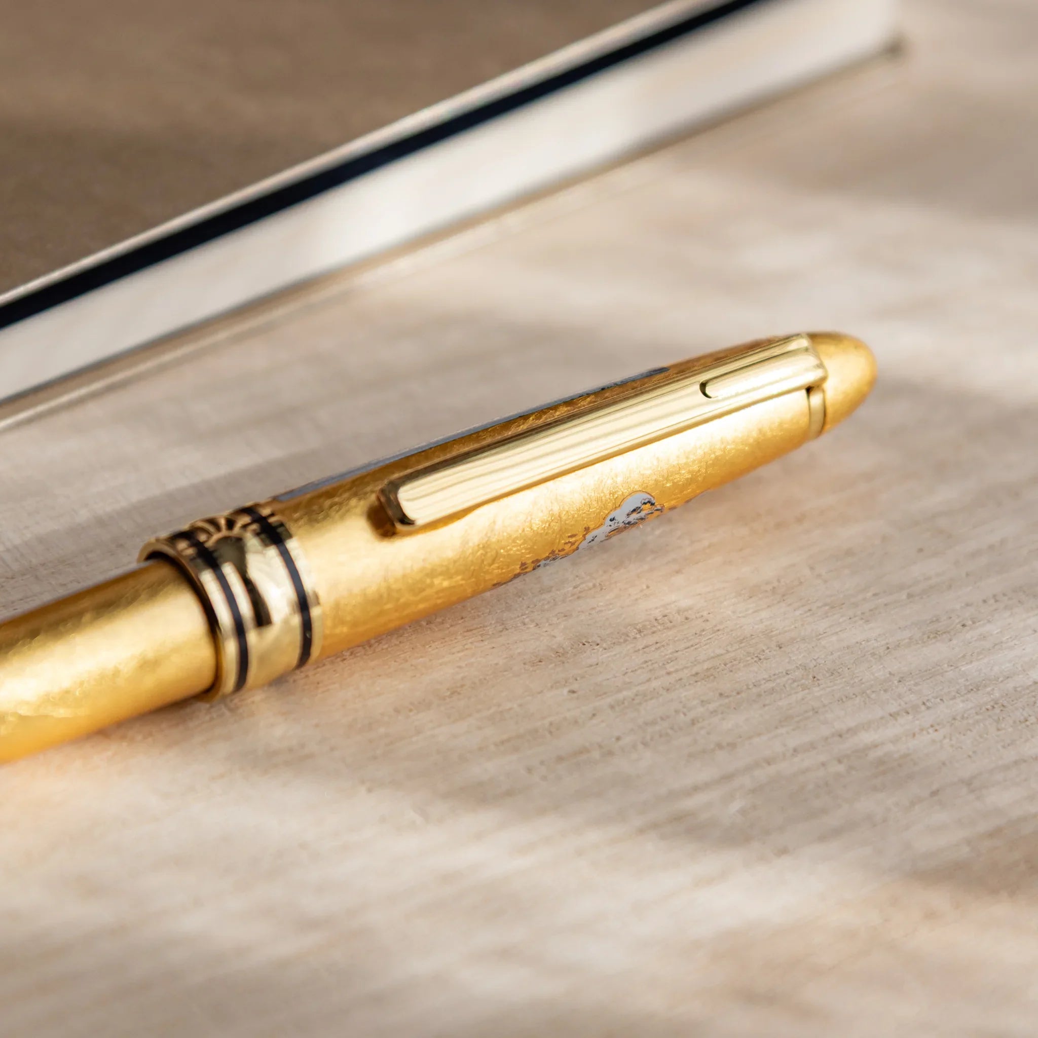Gold Leaf decorated ballpoint featuring traditional Hokusai Great Wave composition shown with gold trim accents