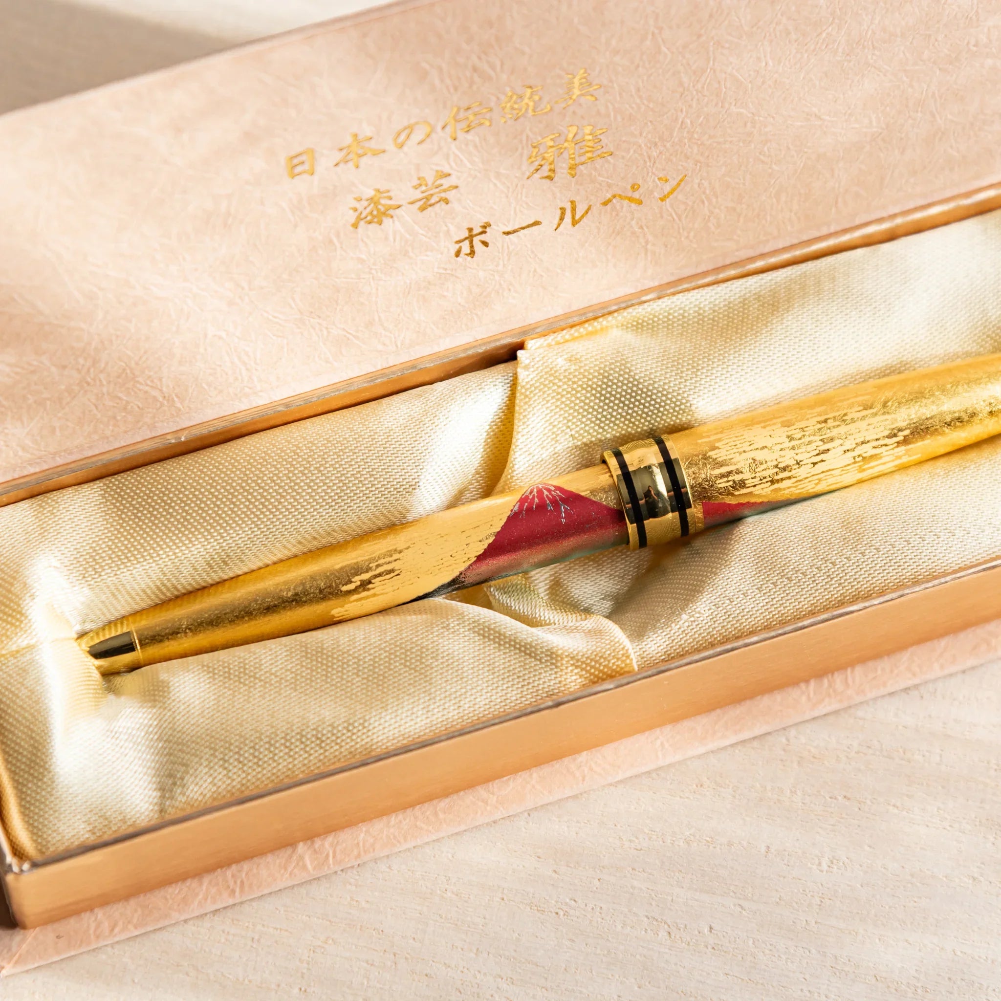 Gold Leaf Mt. Fuji retractable ballpoint in professional product photography shown in composition composition shown