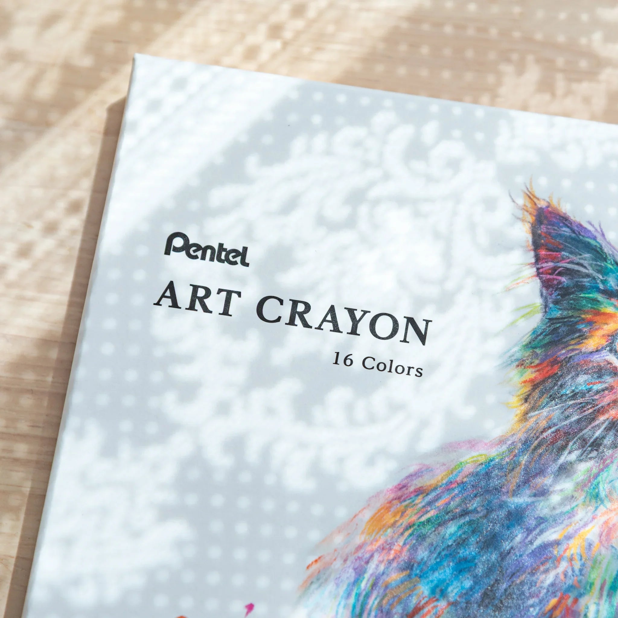 Pentel Art Crayon box of Japanese crayon set showing 'ART CRAYON 16 Colors' text and part of illustrated cat