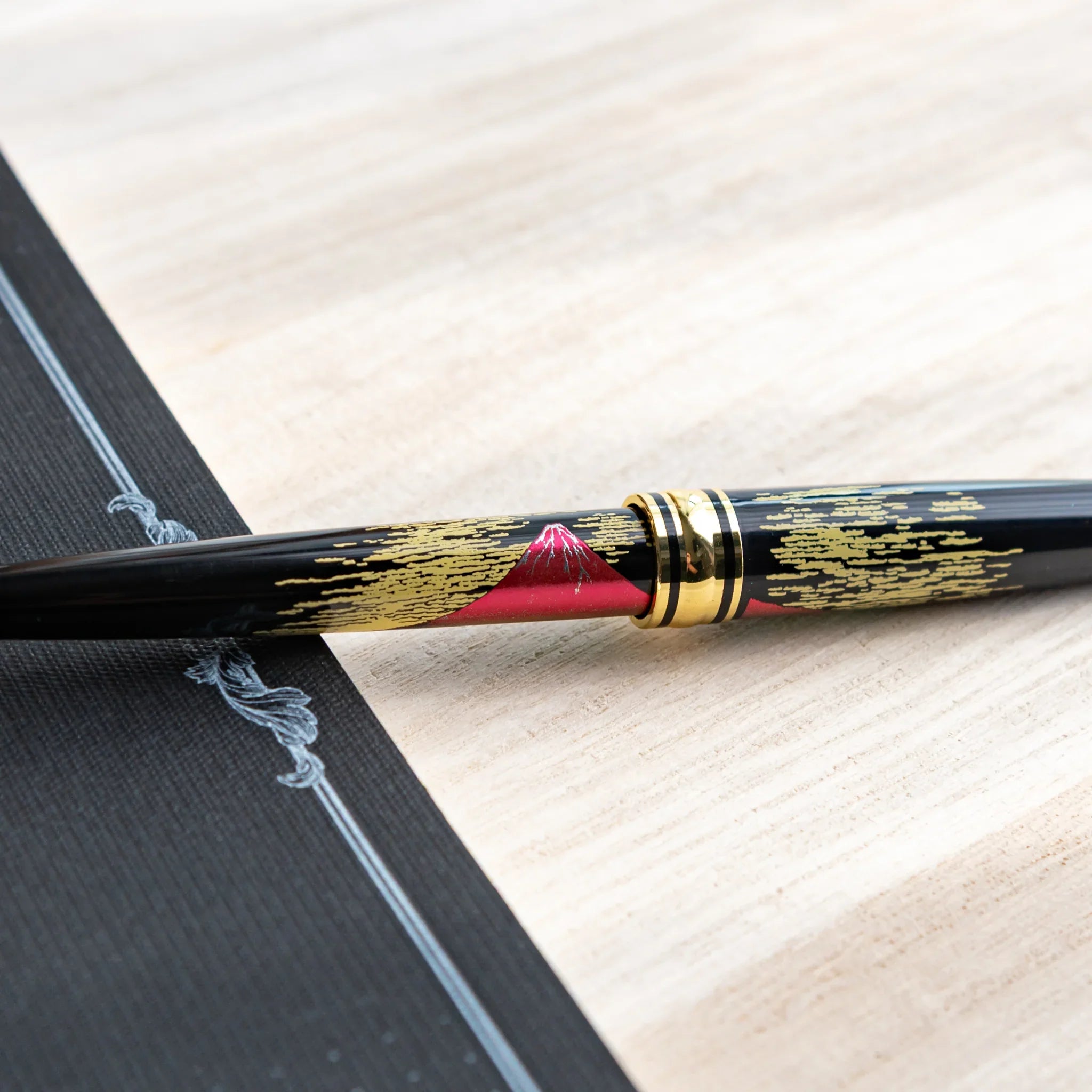 Red Mt.Fuji Yamanaka Retractable Ballpoint Pen, angled view showing all sides providing full visual representation and produc