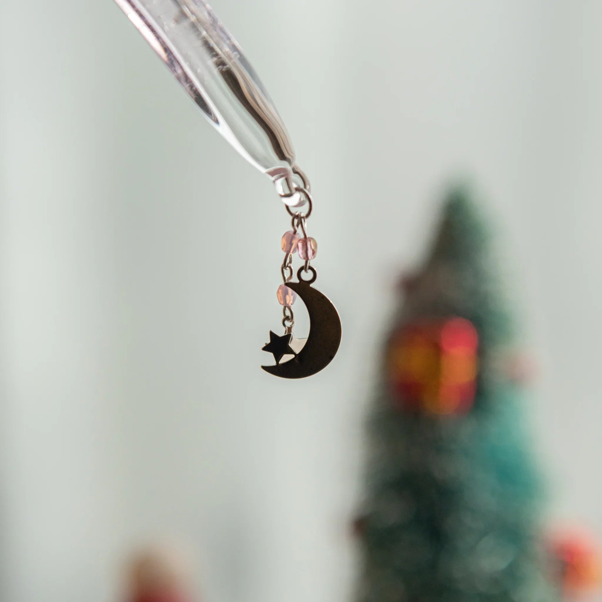 Wish upon a star pink glass dip pen with stellar motif and celestial design pattern throughout the pen in frame