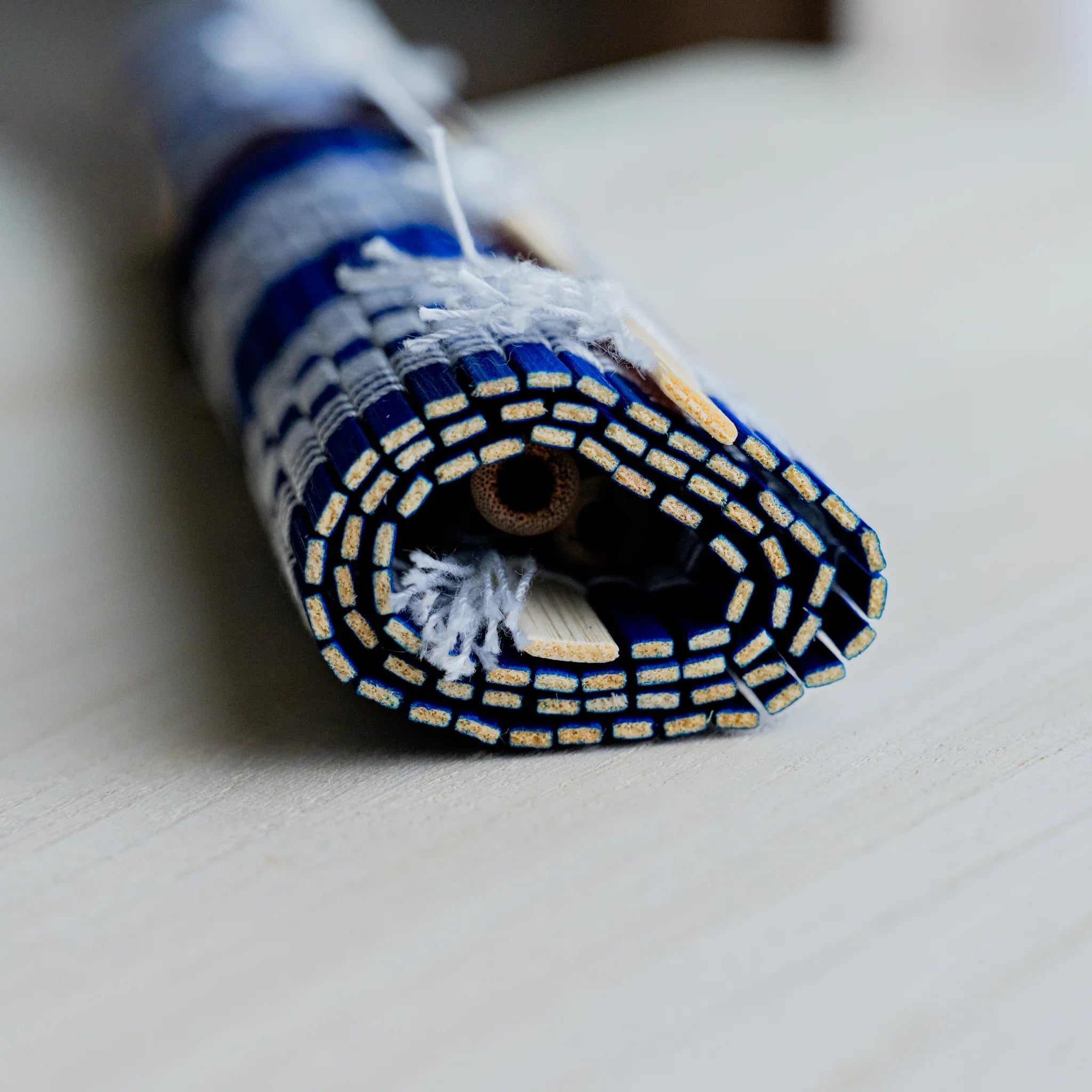 Akashiya bamboo brush roll, blue, flat-laid full view of the mat