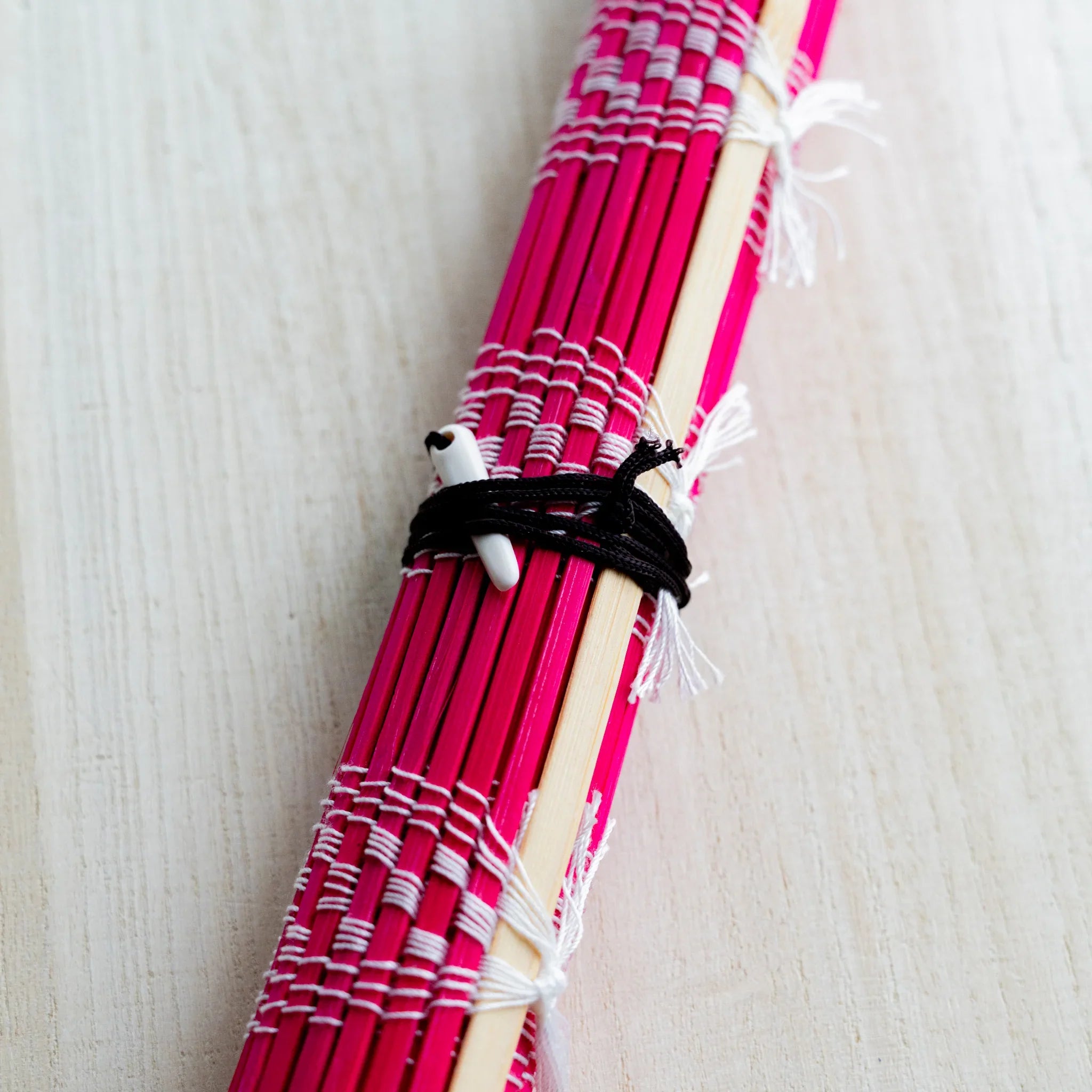 Akashiya bamboo brush roll, red, close-up of the checkered weave pattern