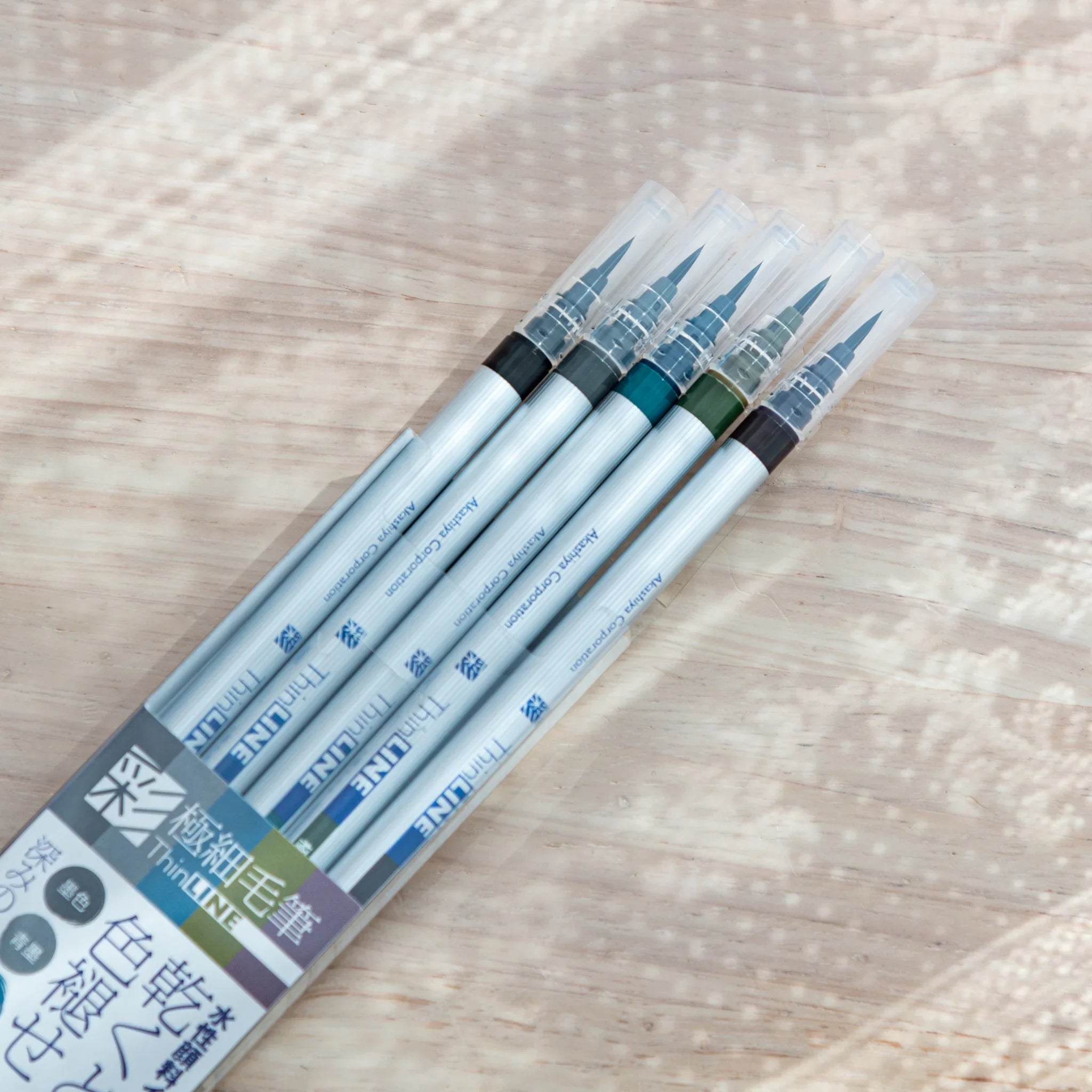 Individual thin-line brush pen with fine flexible nib tip designed for detailed drawing and watercolor art