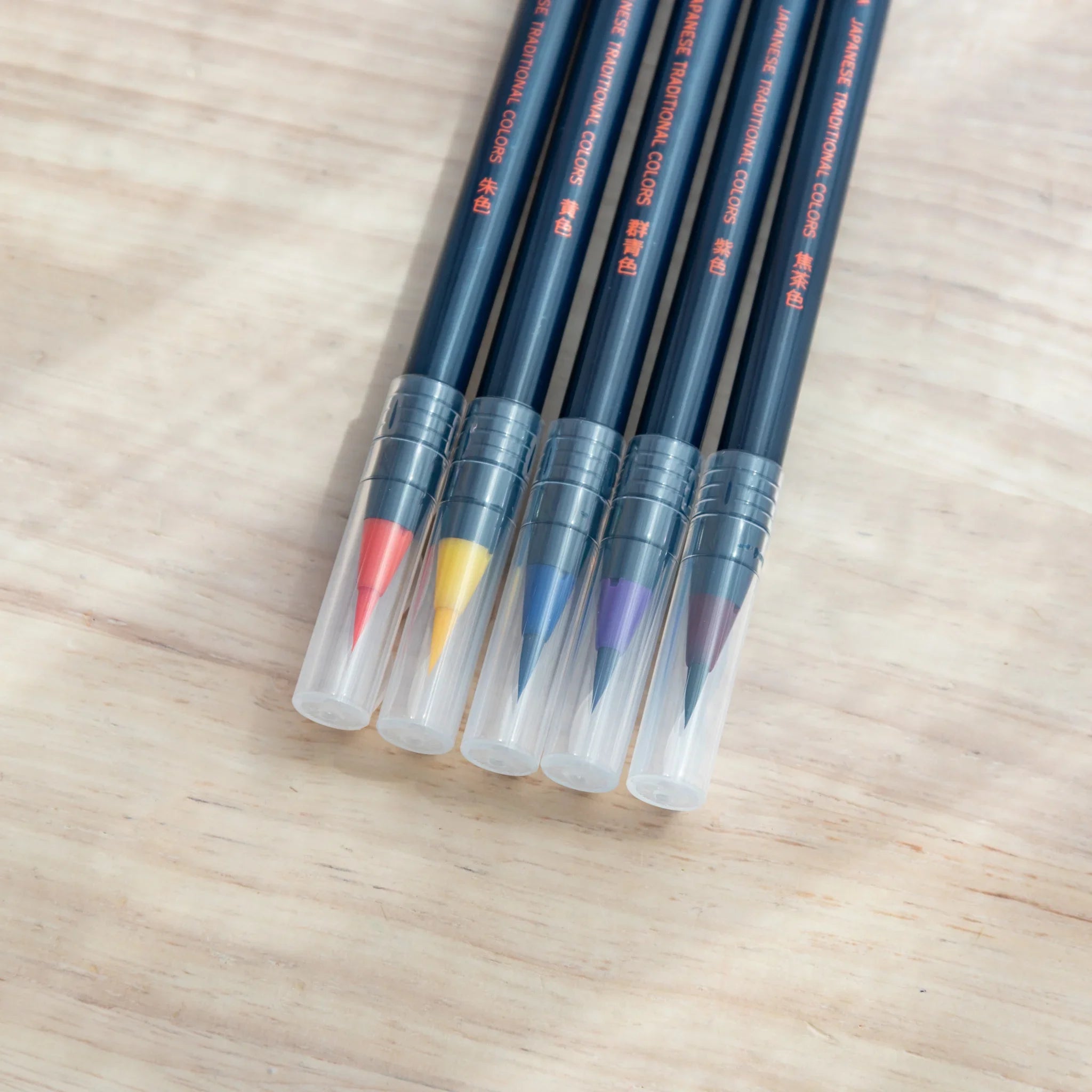 Individual watercolor brush pen with flexible water-based bristle tip designed for autumn-themed painting