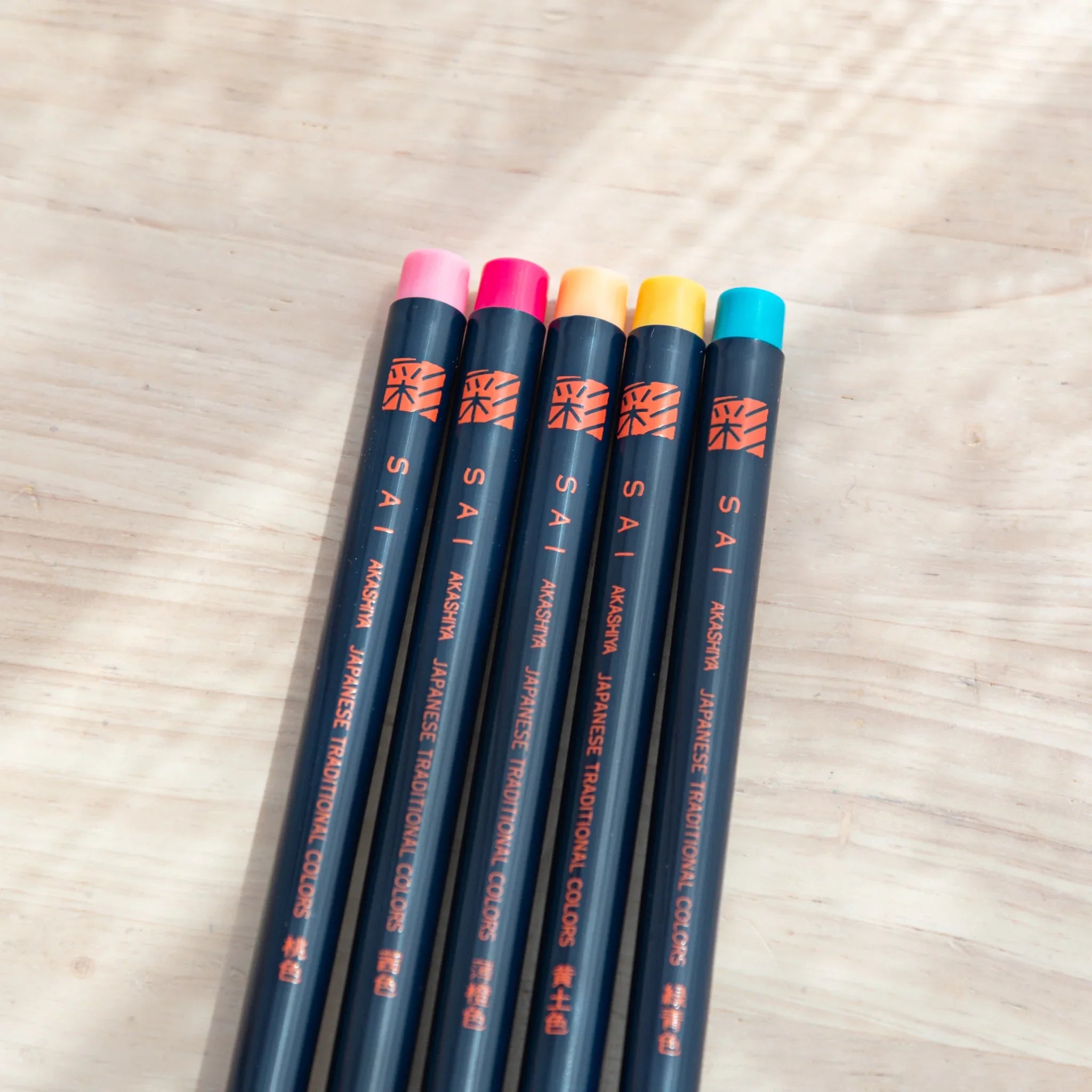 Spring color brush pen tips arranged displaying soft pastel tones for delicate spring-themed painting