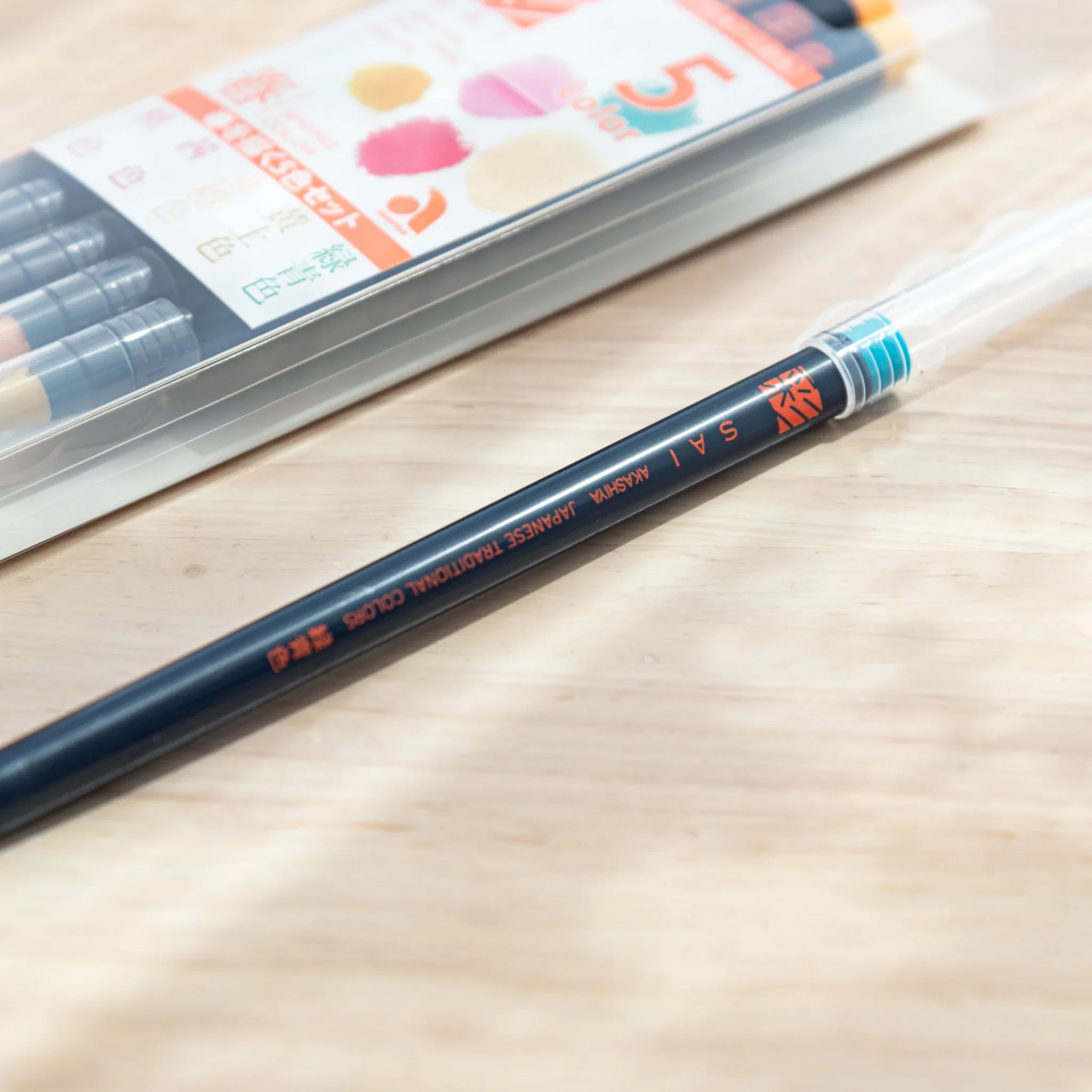 Five spring-colored brush pens showing light pastel pigments ideal for soft-toned seasonal illustration
