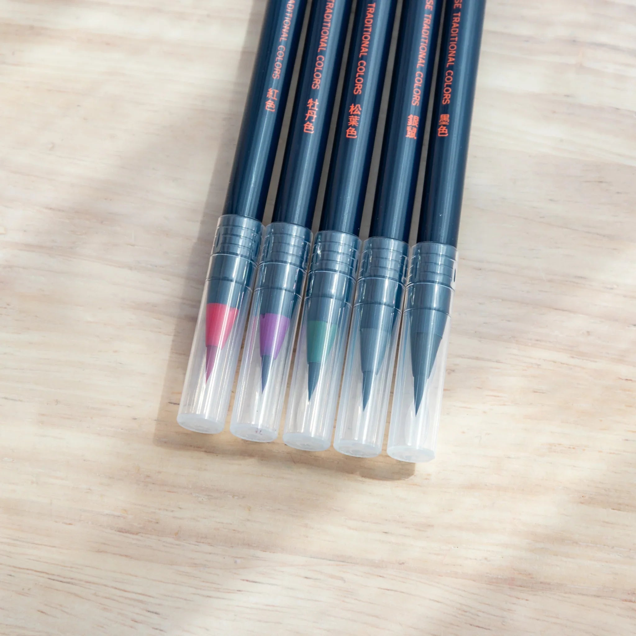 Winter color brush pen tips arranged displaying cool icy tones for winter-themed artistic painting work