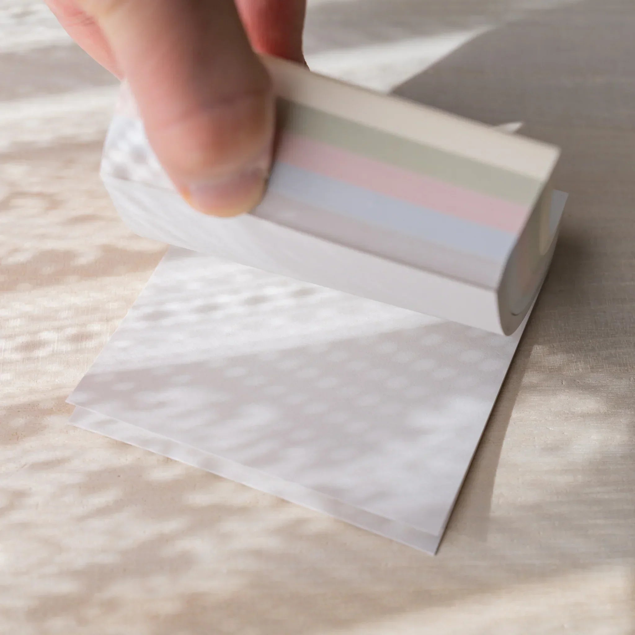 Cardboard packaging box for Arabelle five-color memo pad set showing product image and pastel color palette display