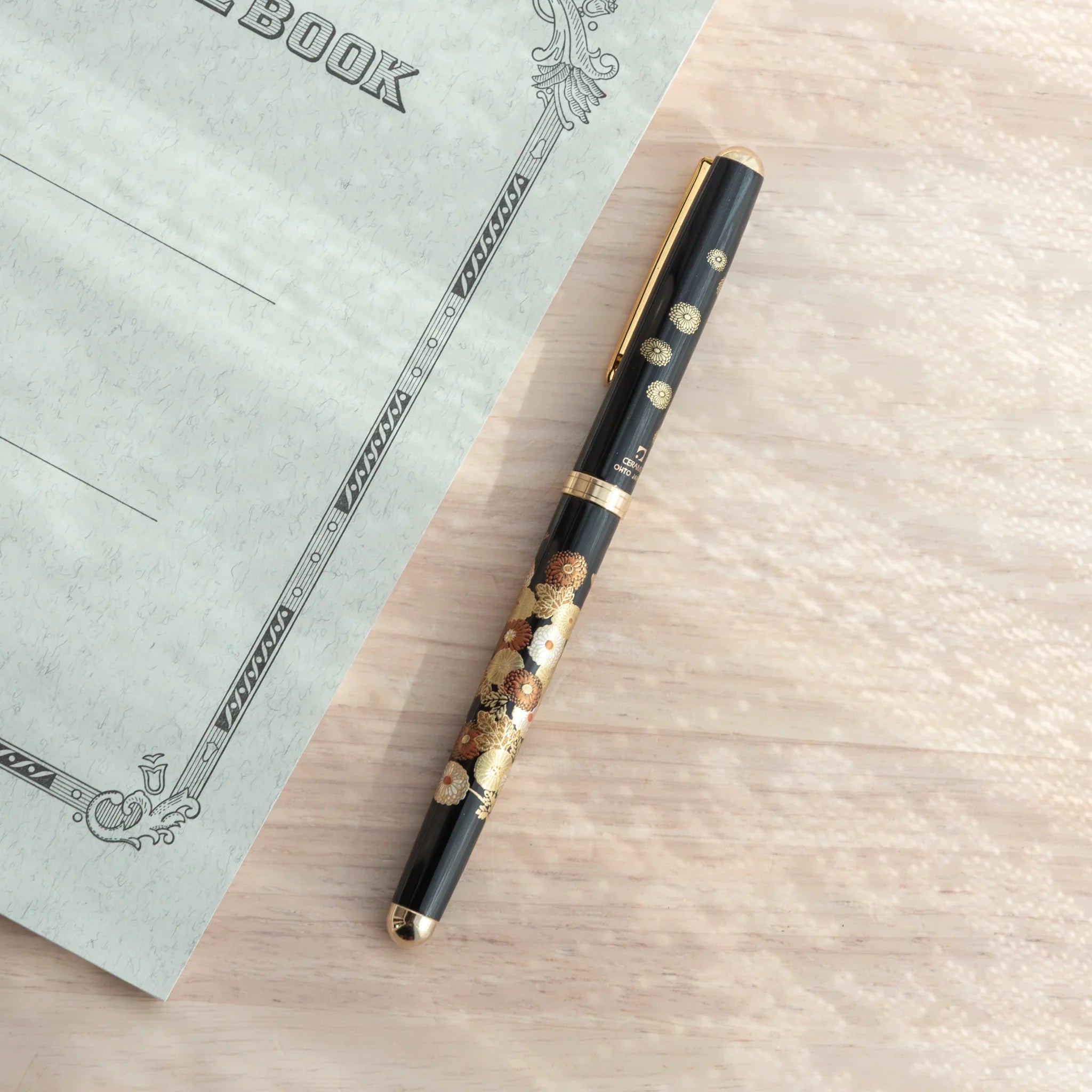 Autumn Blossoms Yamanaka ballpoint pen displays hand-painted lacquer fall foliage and flower detail made