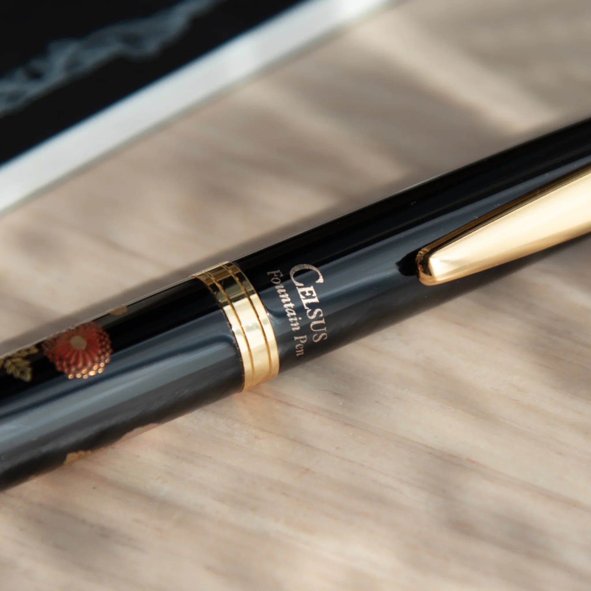 Yamanaka lacquer fountain pen displays hand-painted autumn blossoms in warm lacquer color finish hand-made