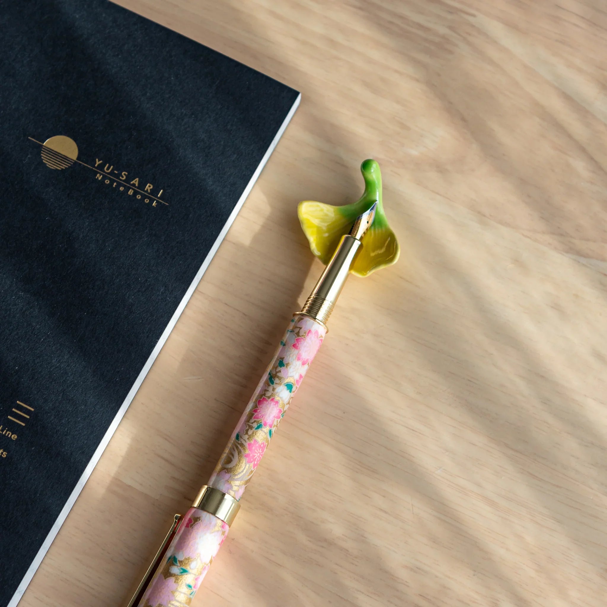 Autumn leaves Japanese handcrafted pen rest with textured carved surface and fall tone finish showing natural leaf design