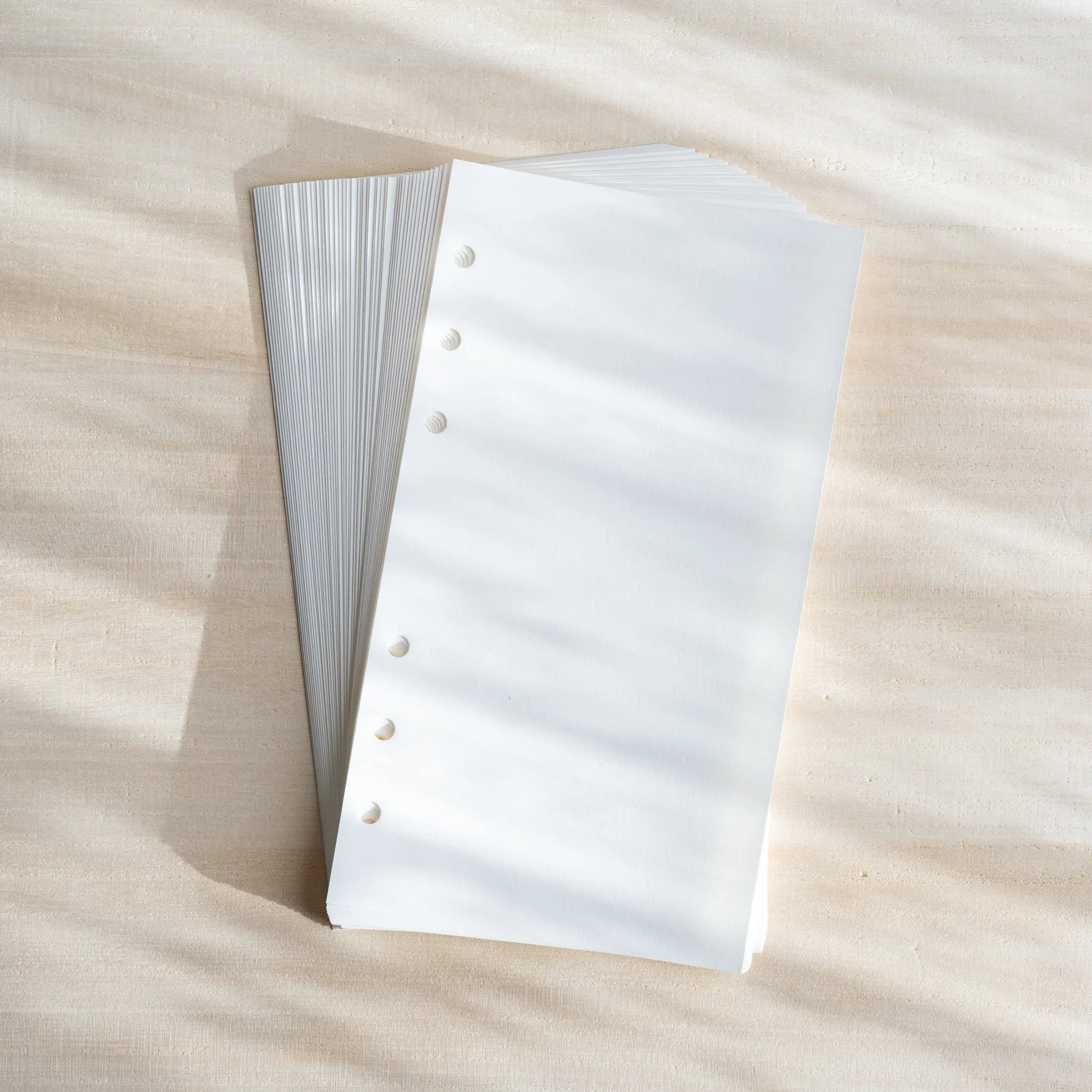 Bank Paper Bible size planner refill showing stack of cream colored paper with lines