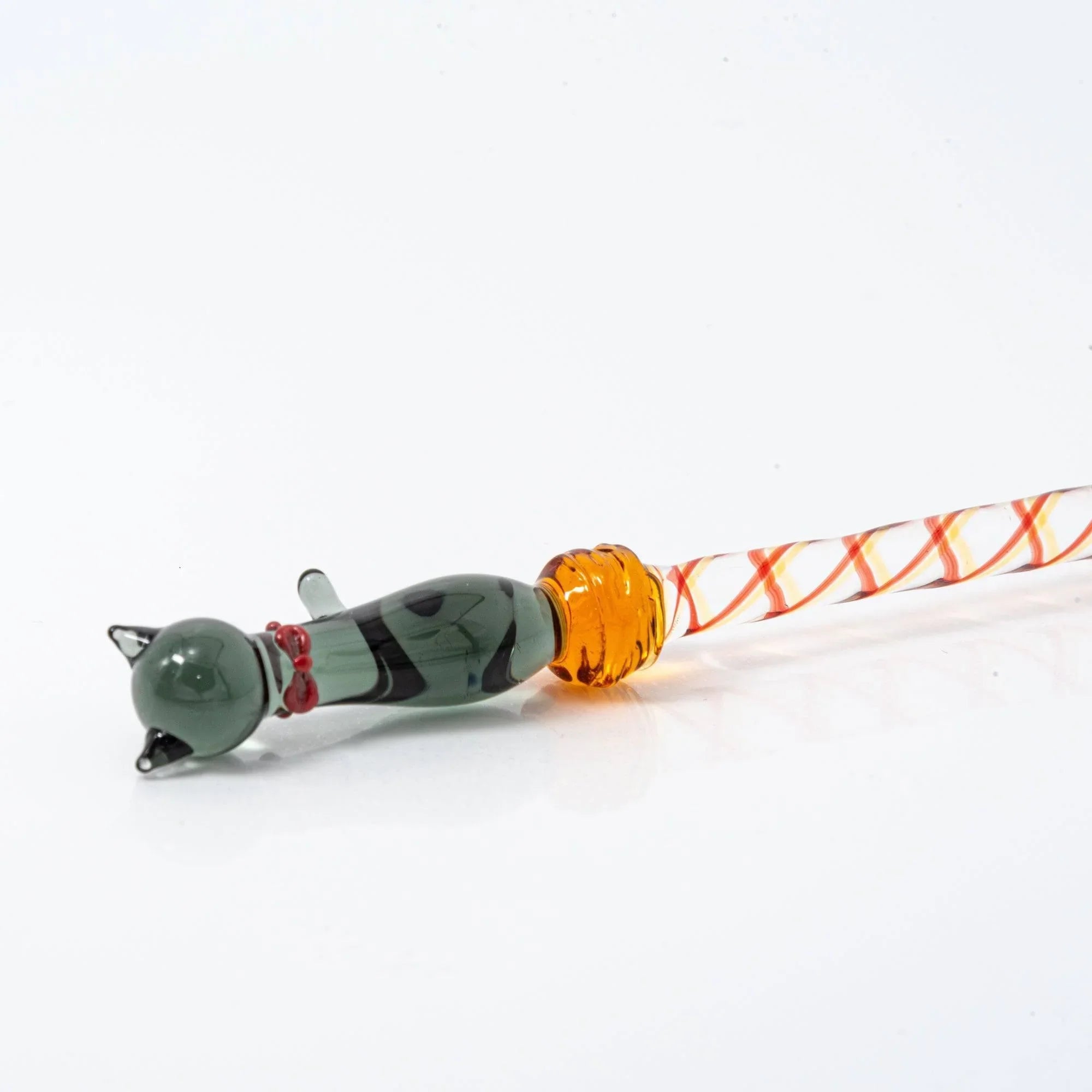Black Nyanko cat glass dip pen detail showing dark green sitting cat with multicolor spiral handle bands
