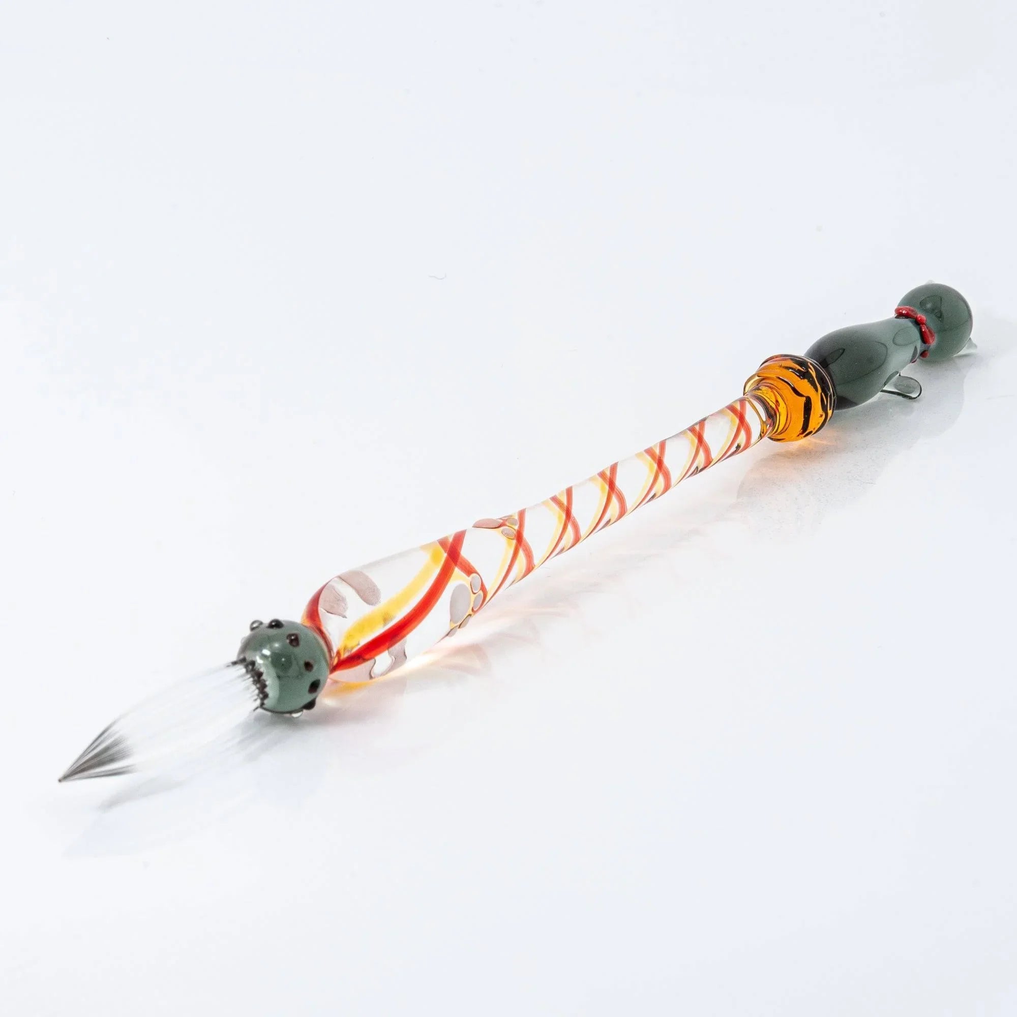 Black Nyanko glass dip pen full view with dark cat figure and red-yellow decorative spiral handle bands