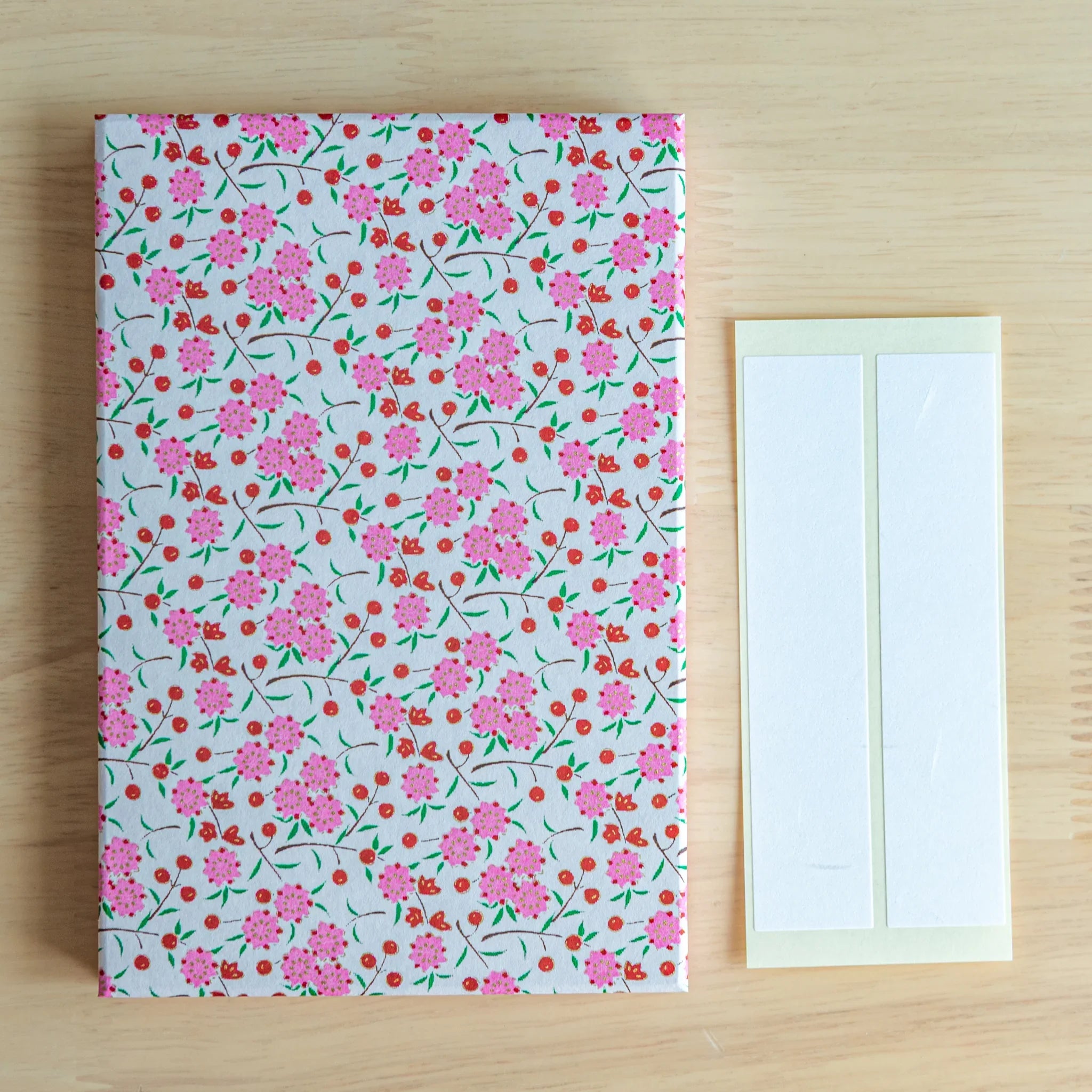 Blossoms and Berries Washi Goshuincho Stamp Book angled view of blooms and berries on washi designed