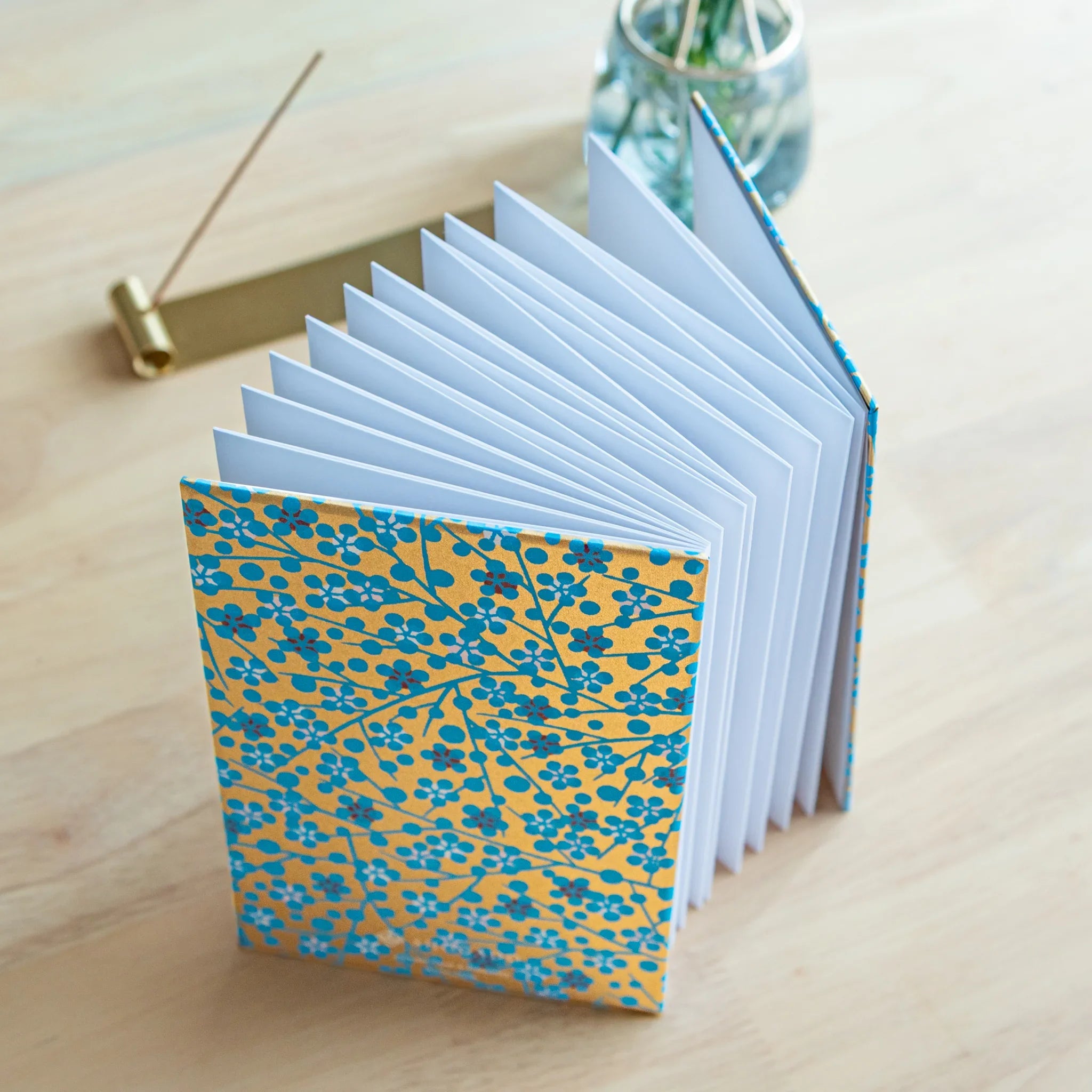 Blue Flower Washi Goshuincho accordion fold stamp book opened displaying multiple pages with Japanese temple design