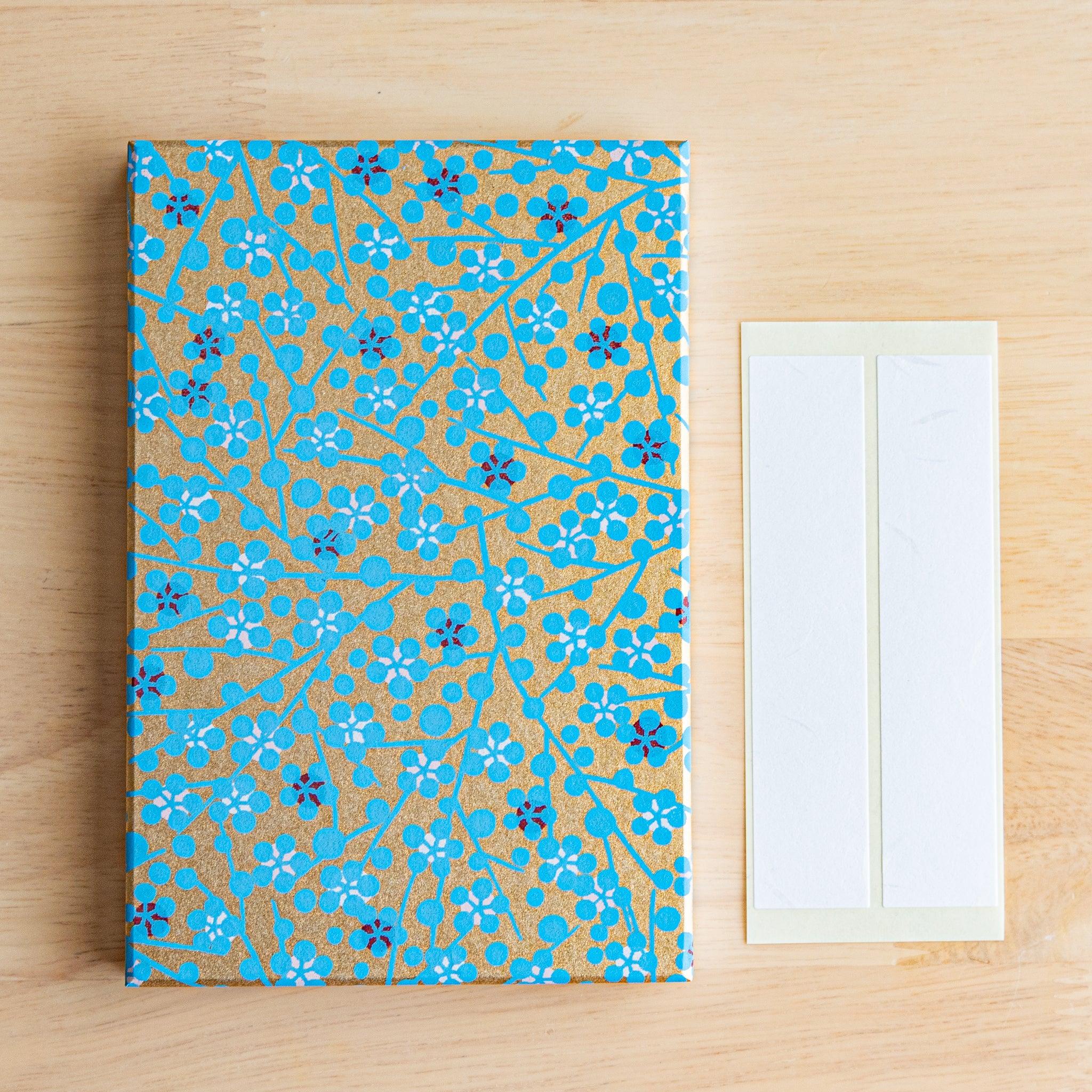 Blue Flower Washi Goshuincho open pages flat lay showing interior accordion folds and gold pattern on blue washi