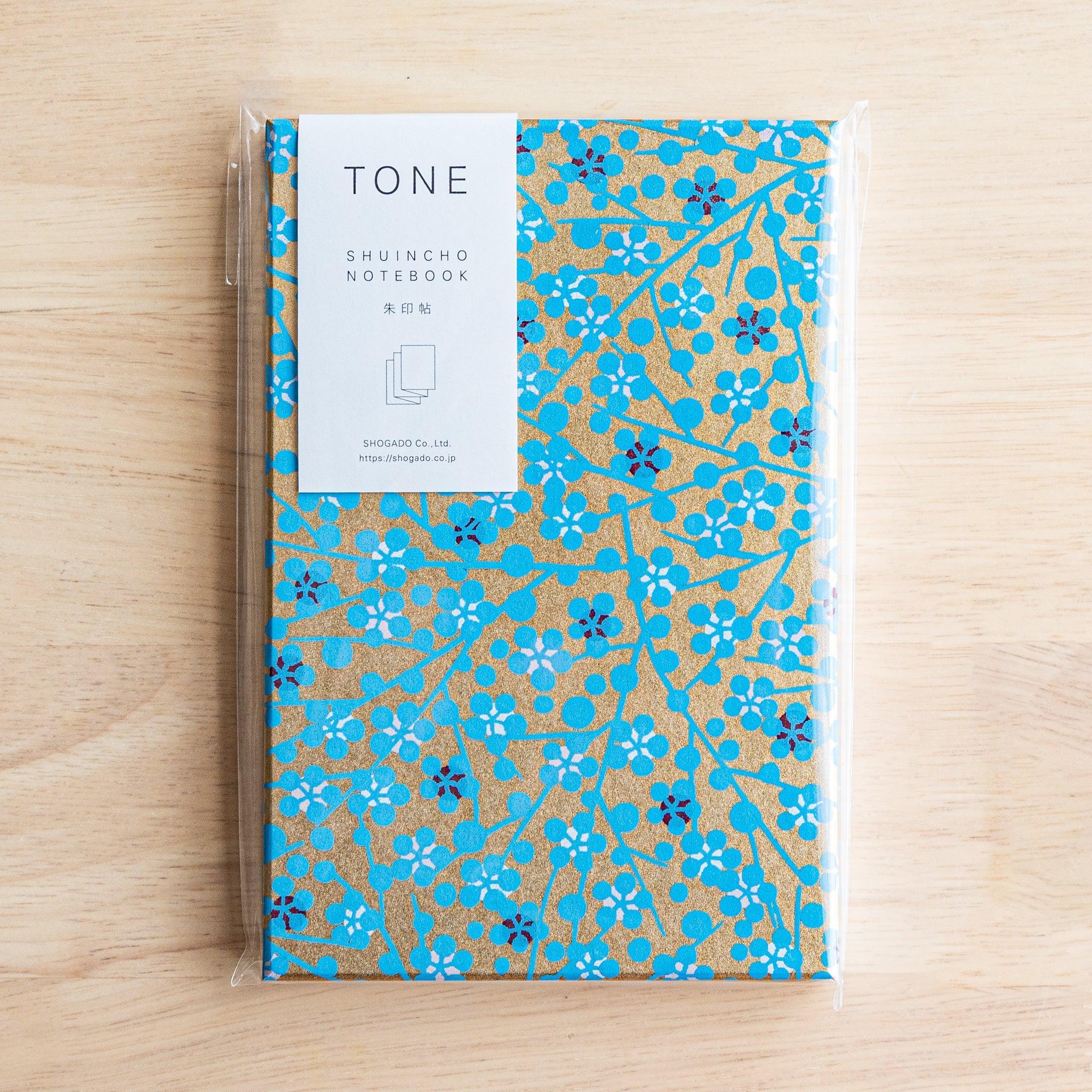 Blue floral Goshuinsho stamp book in packaging labeled TONE SHUINCHO NOTEBOOK by SHOGADO of Japan.