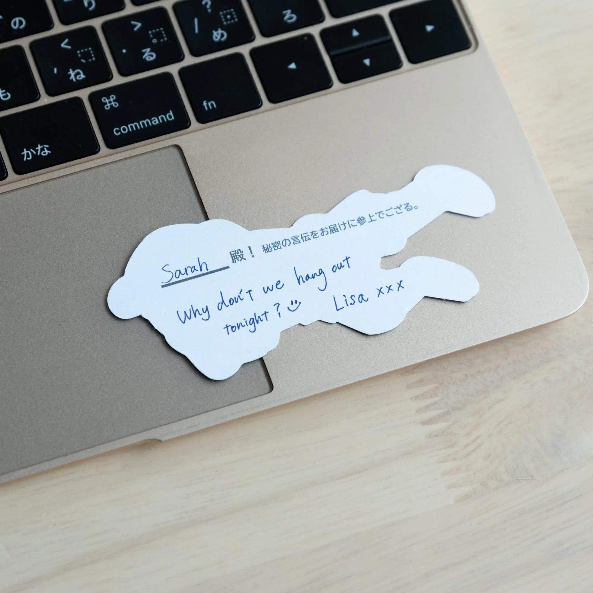 White cloud-shaped blank washi message card with Japanese text at top and writing area showing product quality and design