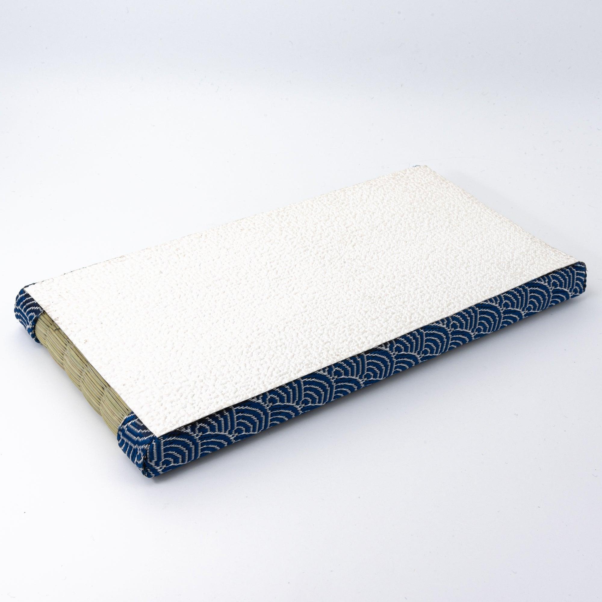 A tatami pen tray with blue wave-patterned borders, traditionally designed to complement the aesthetic of Japanese stationery and writing tools.