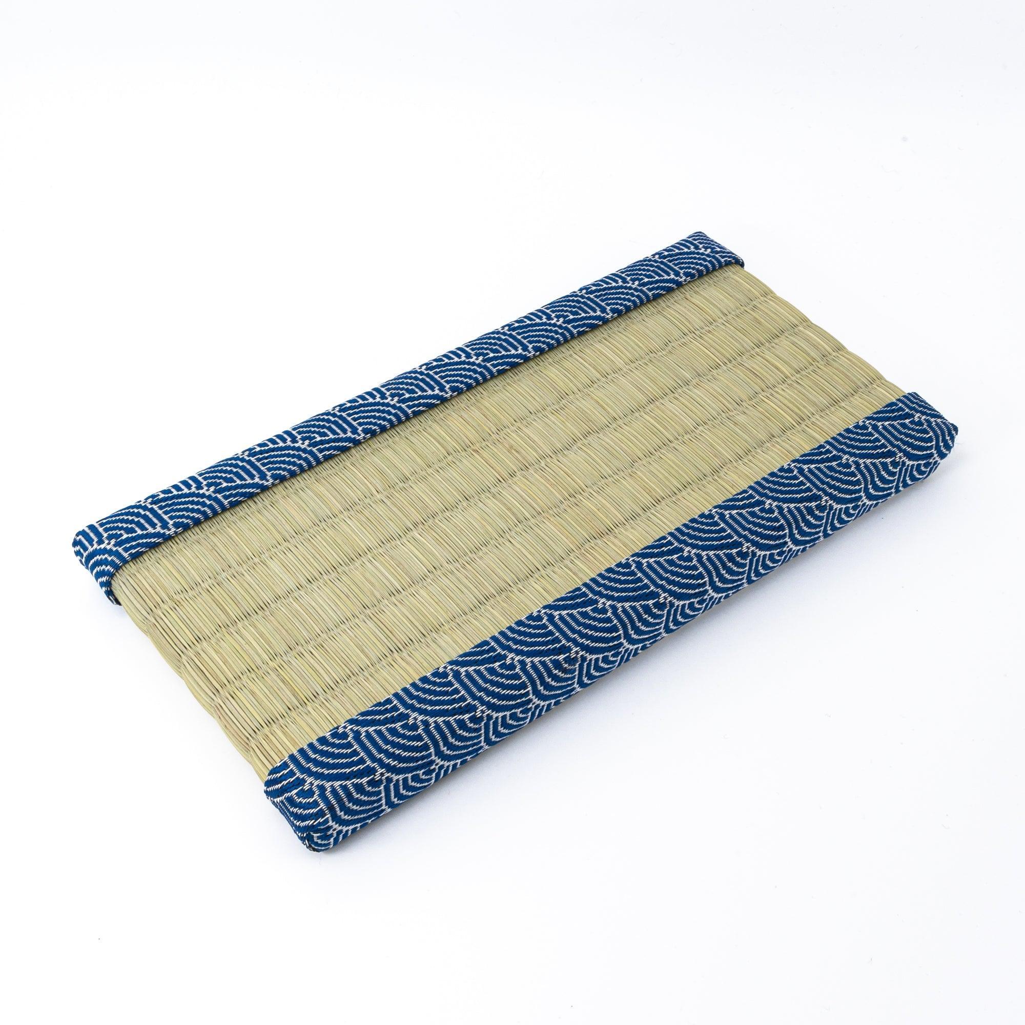 A tatami pen tray with blue wave-patterned borders, traditionally designed to complement the aesthetic of Japanese stationery and writing tools.