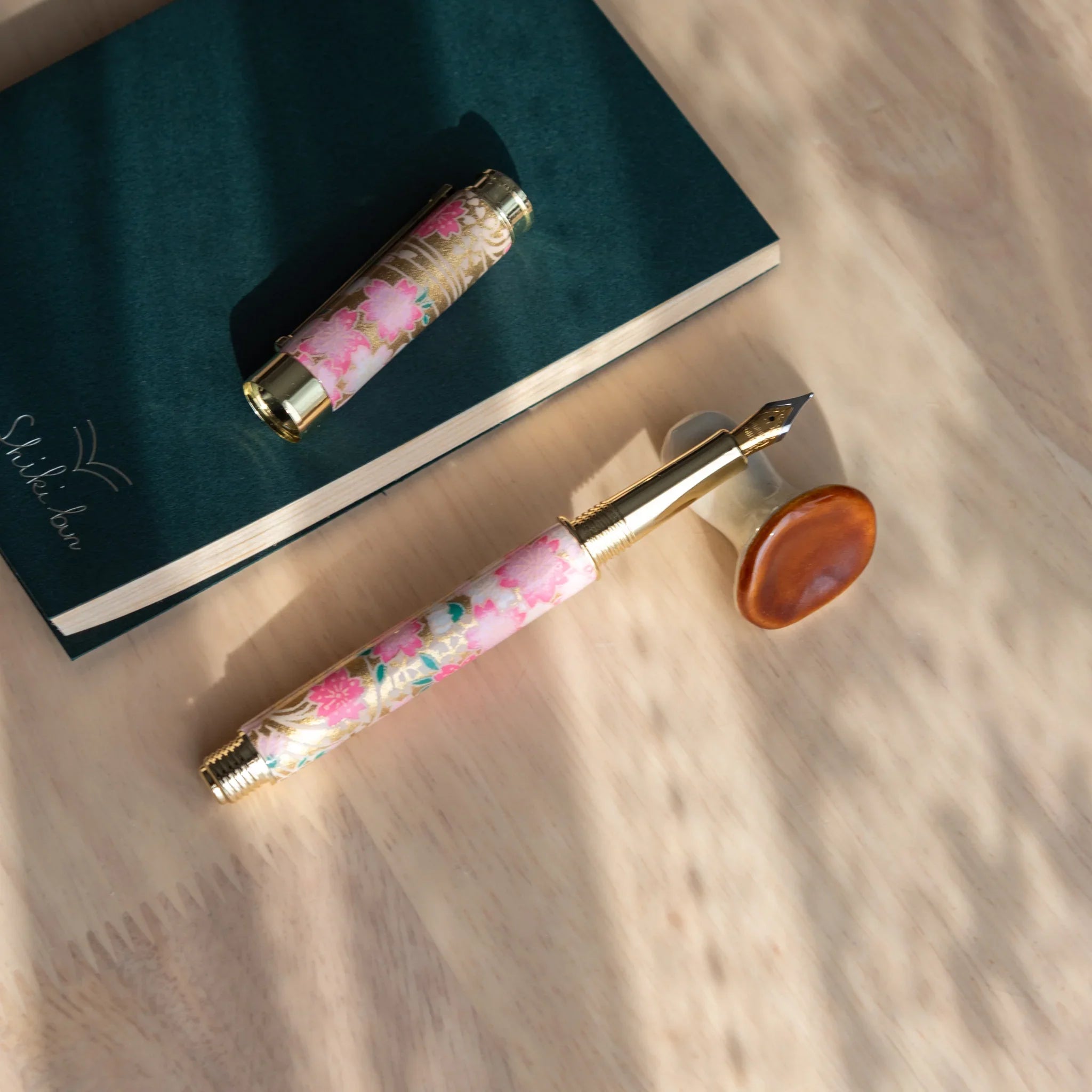 Brown handcrafted mushroom-shaped pen rest with ceramic detailing, textured glaze surface on wooden display detail