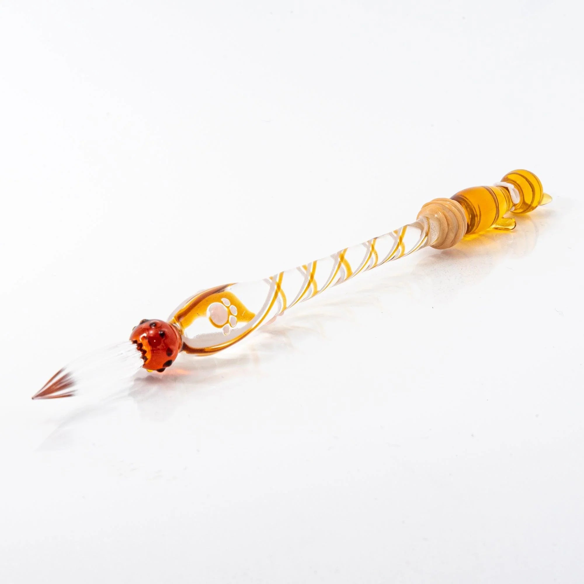 Brown Tabby Nyanko cat glass dip pen side view showing striped glass handle and red cat head nib with handle detail and