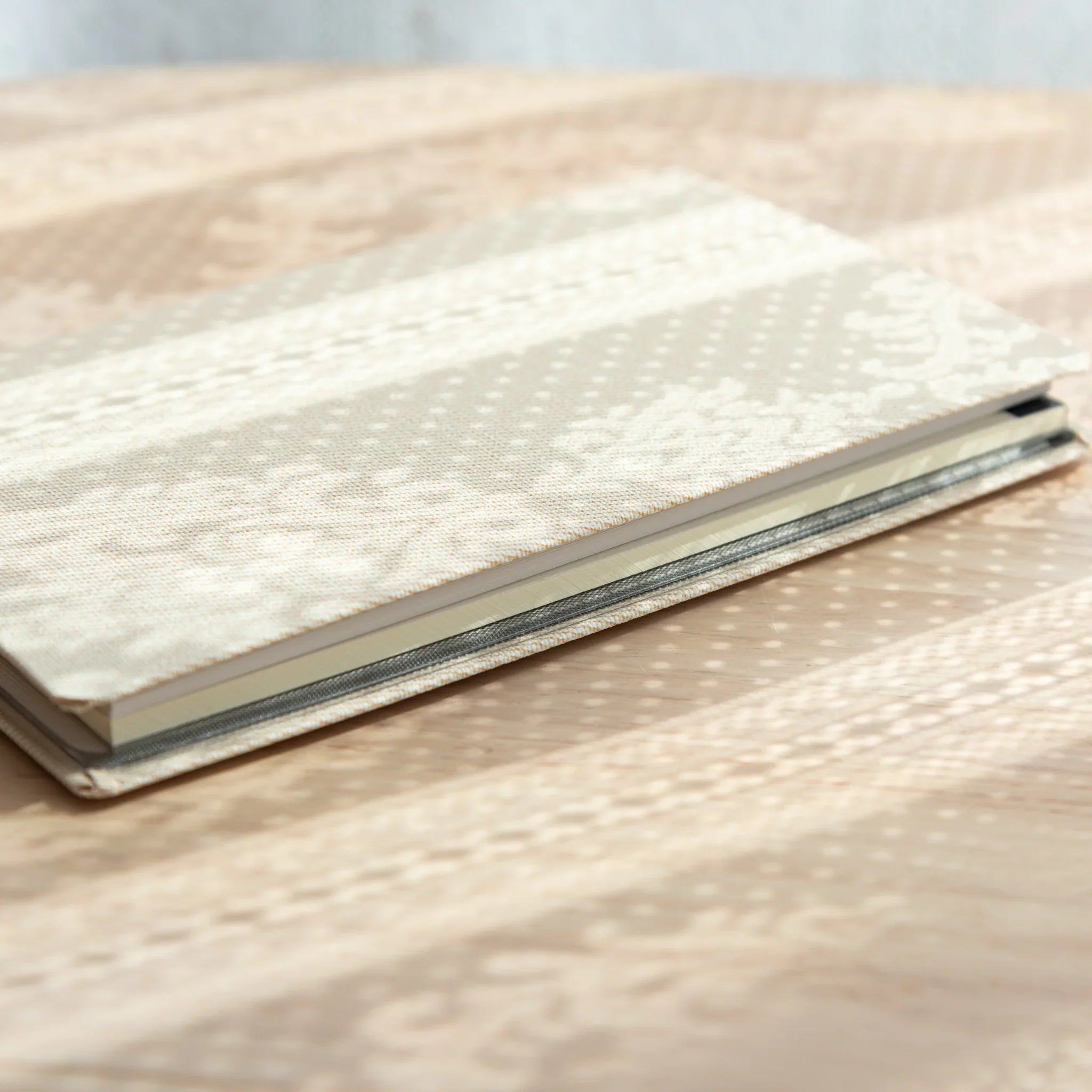 Side view of Bullet Jotter Japanese Writing Pad – Gabardine Ivory White, showing binding and cover detail.