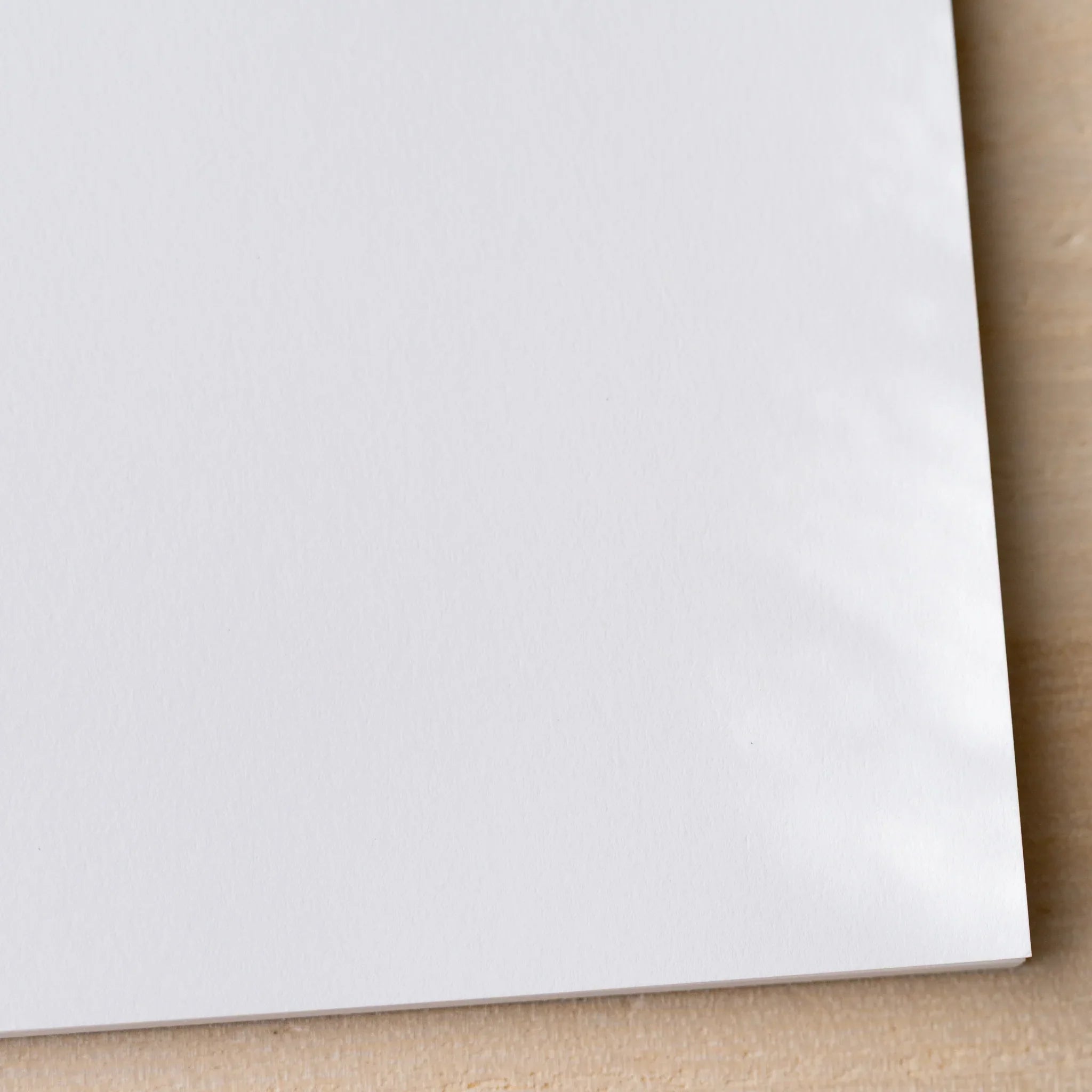 Corner close-up of Yamamoto Paper Canopus Bullet Paper No.2 73gsm Japanese paper stationery notepad.