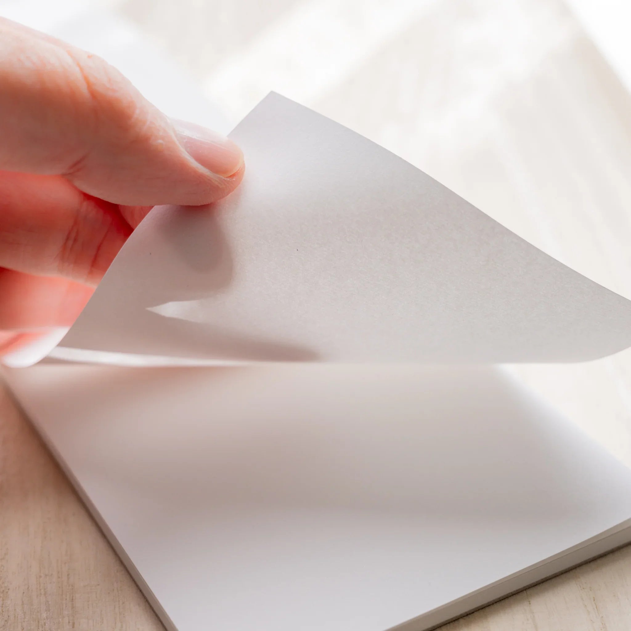 Hand peeling a 73gsm Canopus sheet from Yamamoto Paper Bullet Paper No.2 notepad.