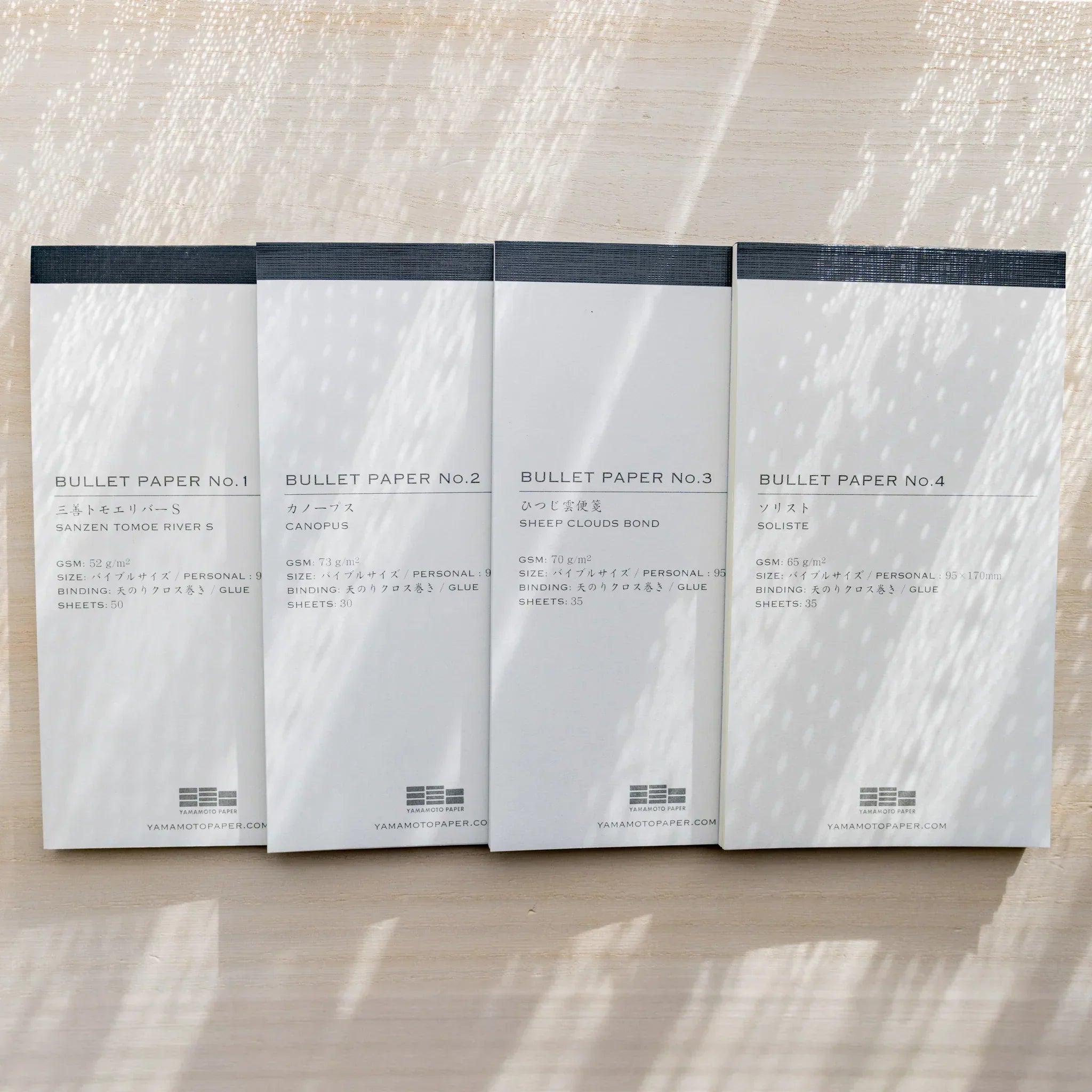 Lineup of Yamamoto Paper Bullet Paper No.1-4 notepads: Sanzen Tomoe River S, Canopus, Sheep Clouds Bond, Soliste.
