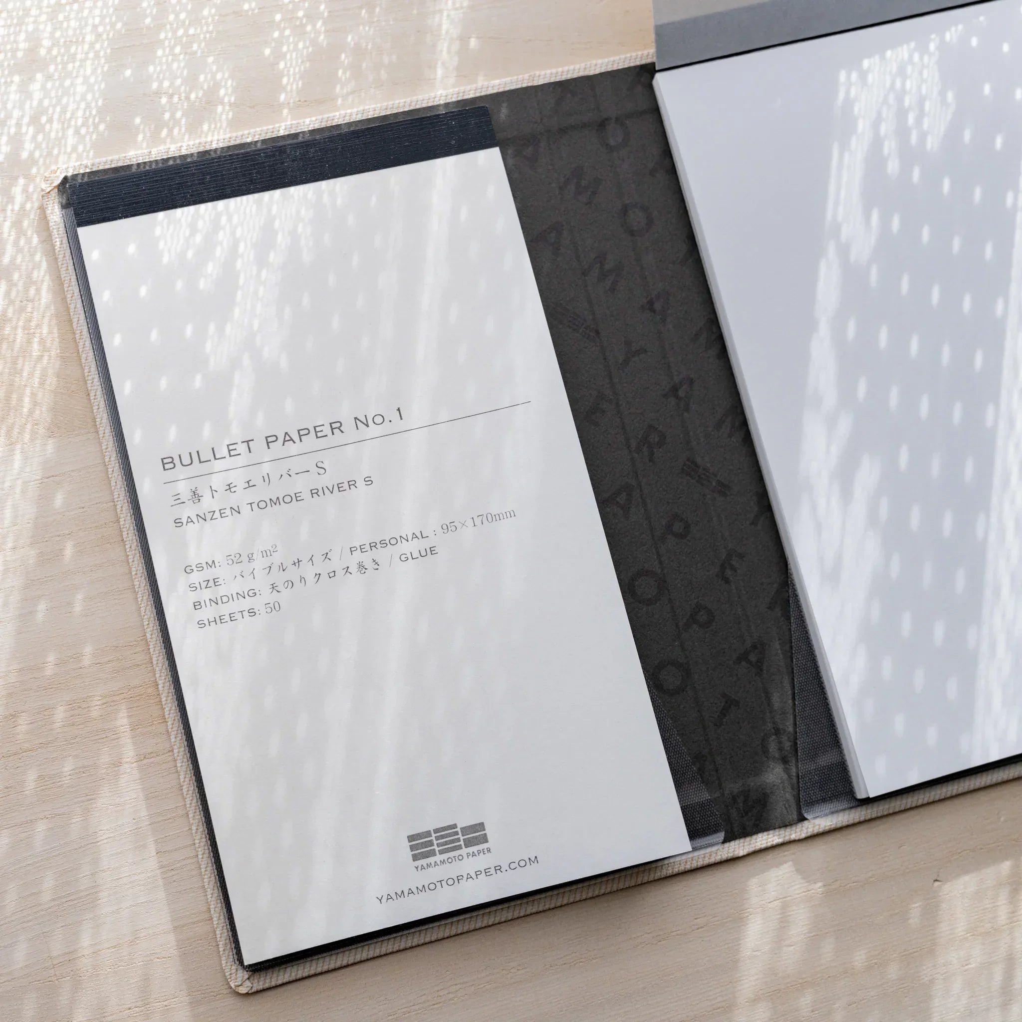 Yamamoto Paper Sanzen Tomoe River S Bullet Paper No.1 notepad inserted in a Yamamoto Paper notebook cover.