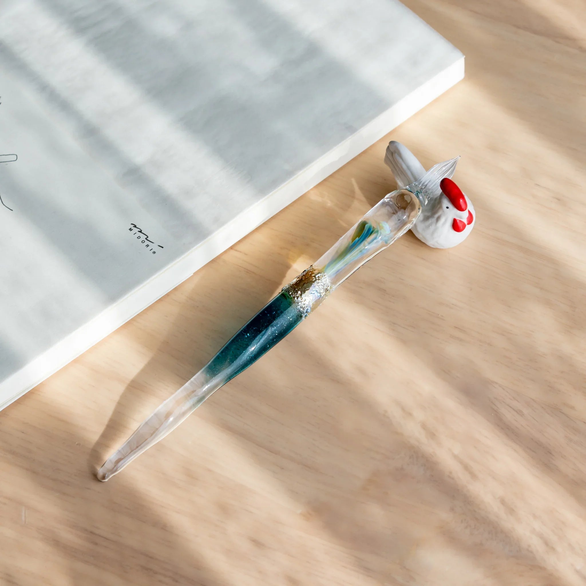 Chabo rooster ceramic pen rest handcrafted Japanese with colorful feather details and traditional bird close shot