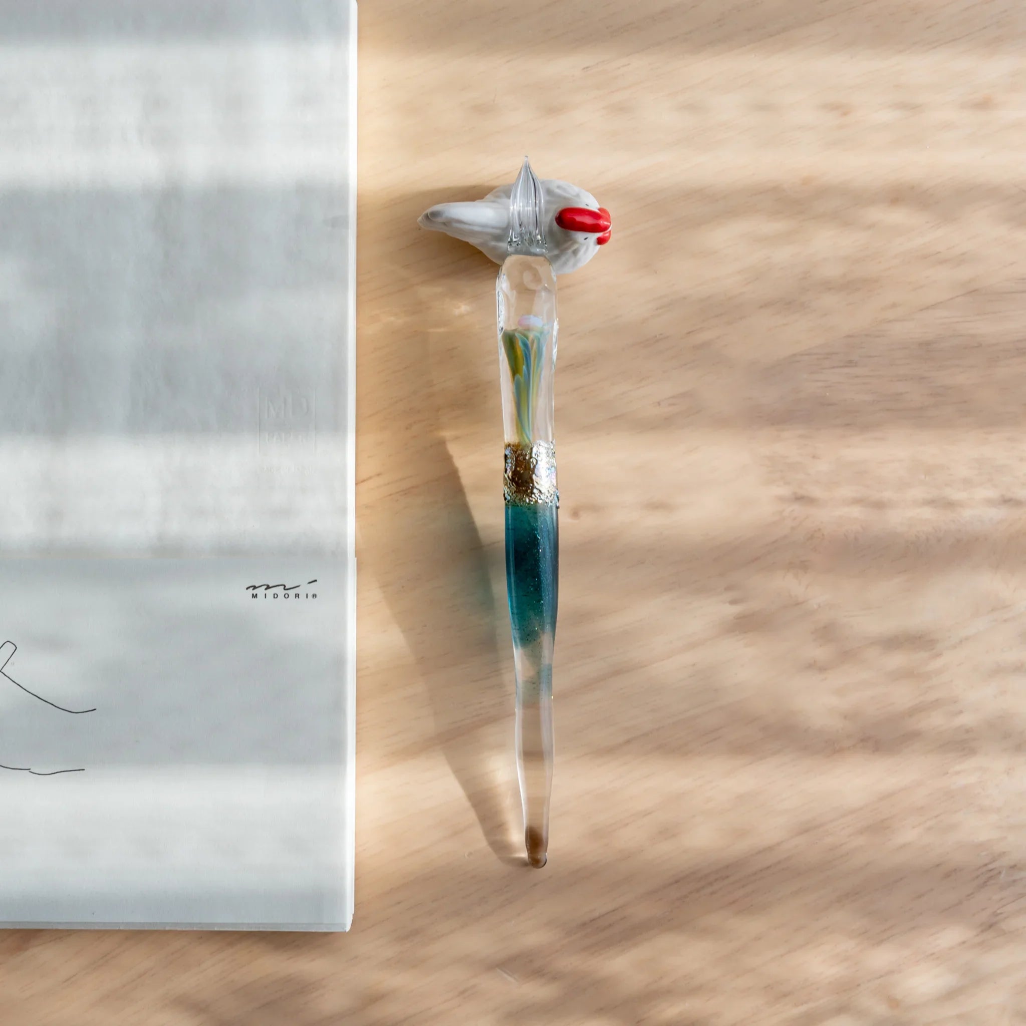 Chabo rooster ceramic pen rest handcrafted Japanese with realistic bird details and feather texture form close shot