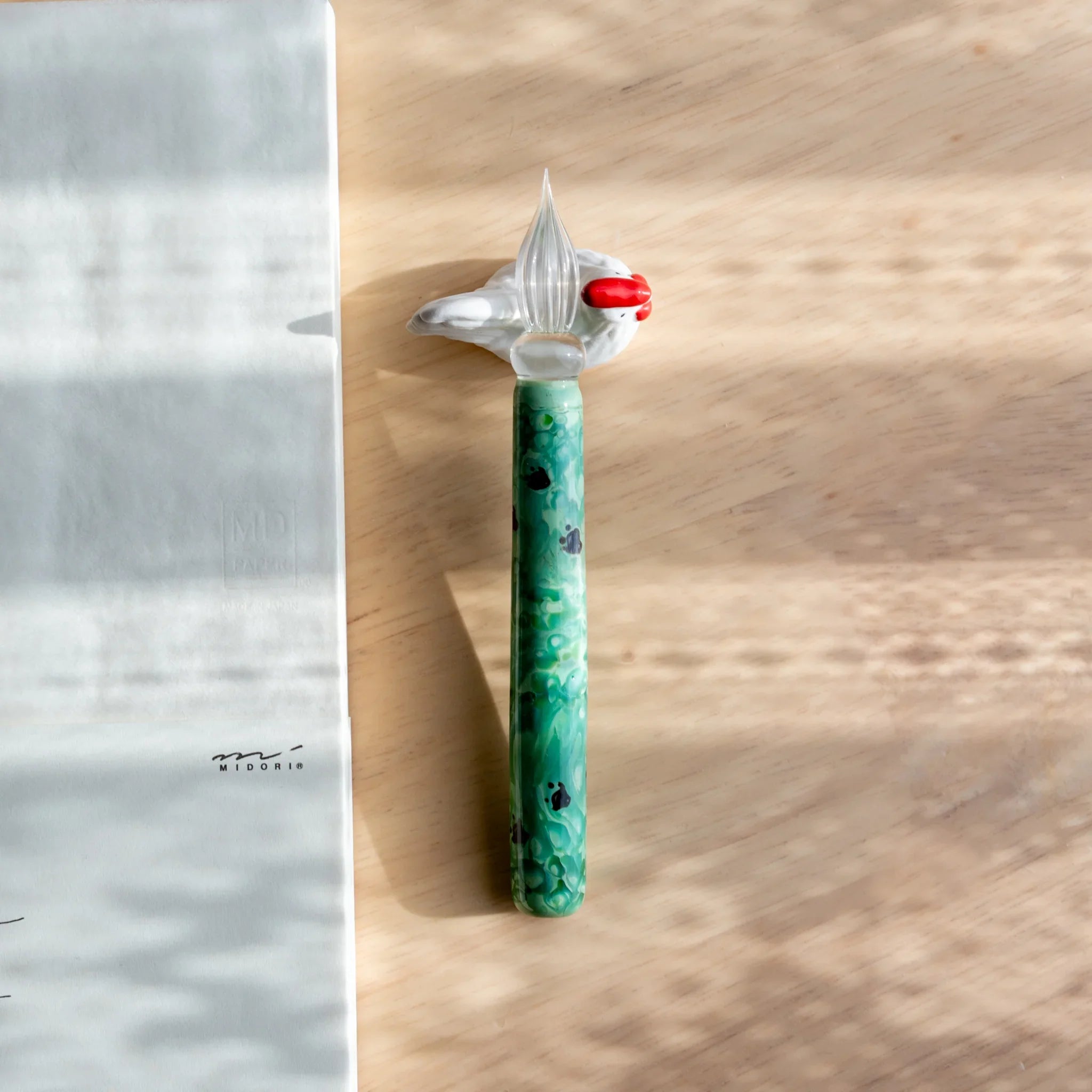 Chabo rooster ceramic pen rest handcrafted Japanese with traditional bird style and decorative coloring close shot