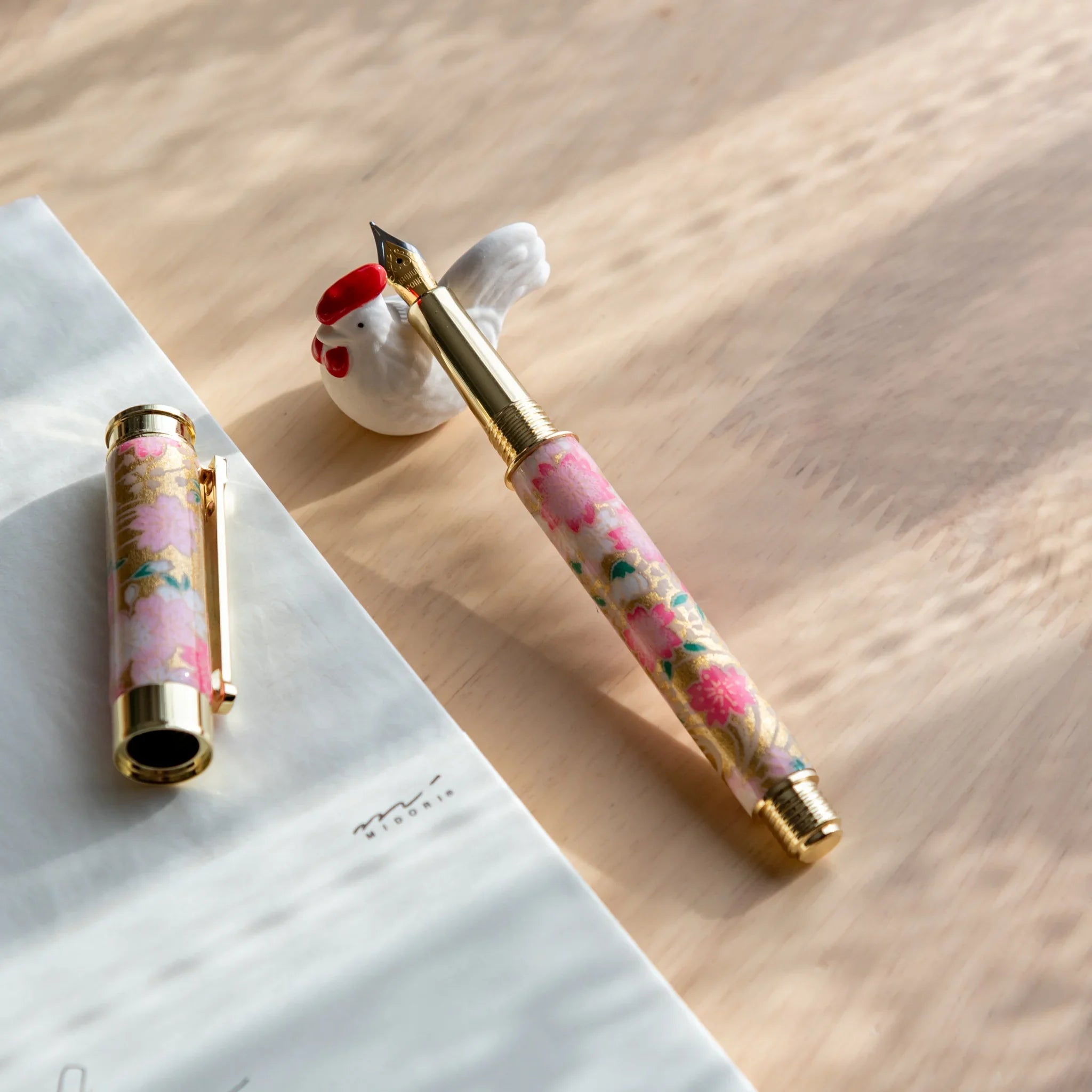 Chabo rooster handcrafted ceramic pen rest Japanese with decorative rooster form close shot