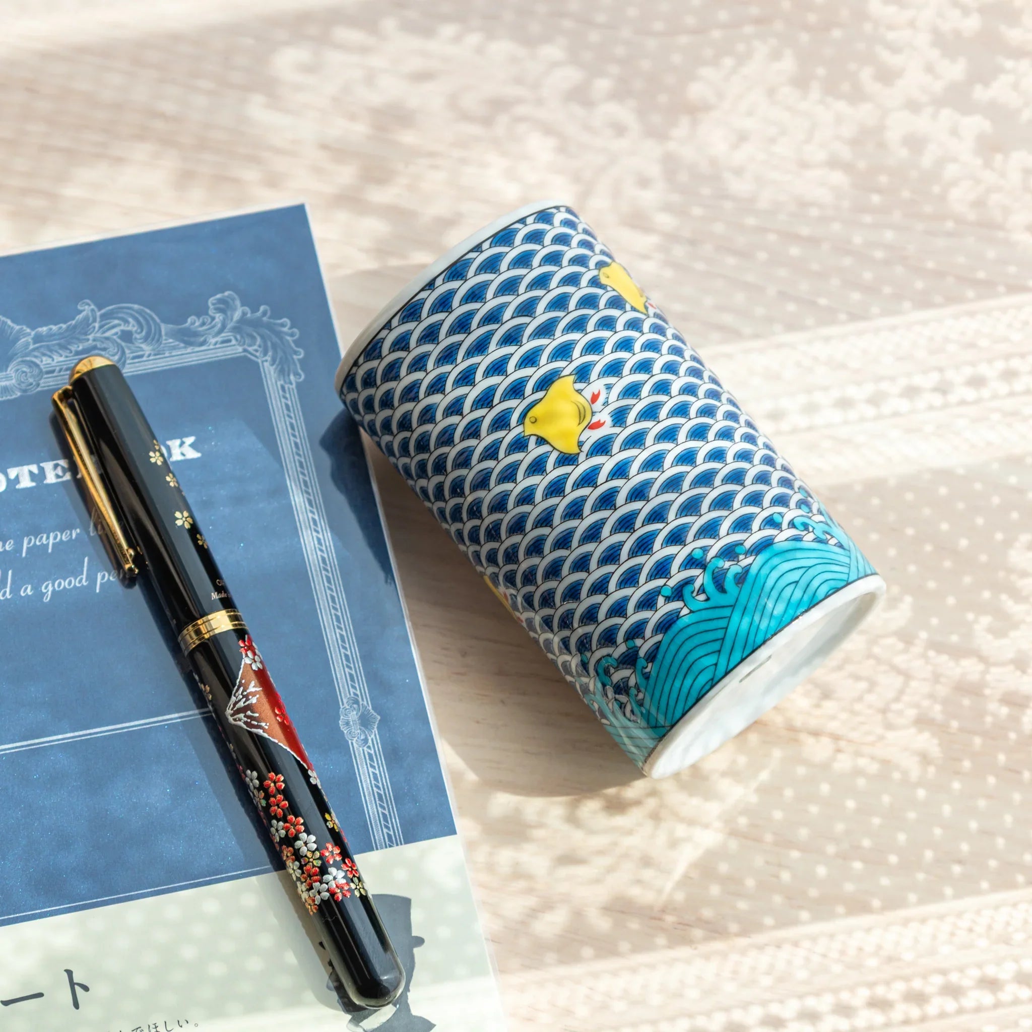 Japanese Kutani ceramic pen holder displaying chidori birds in traditional pottery style featuring traditional porcelain