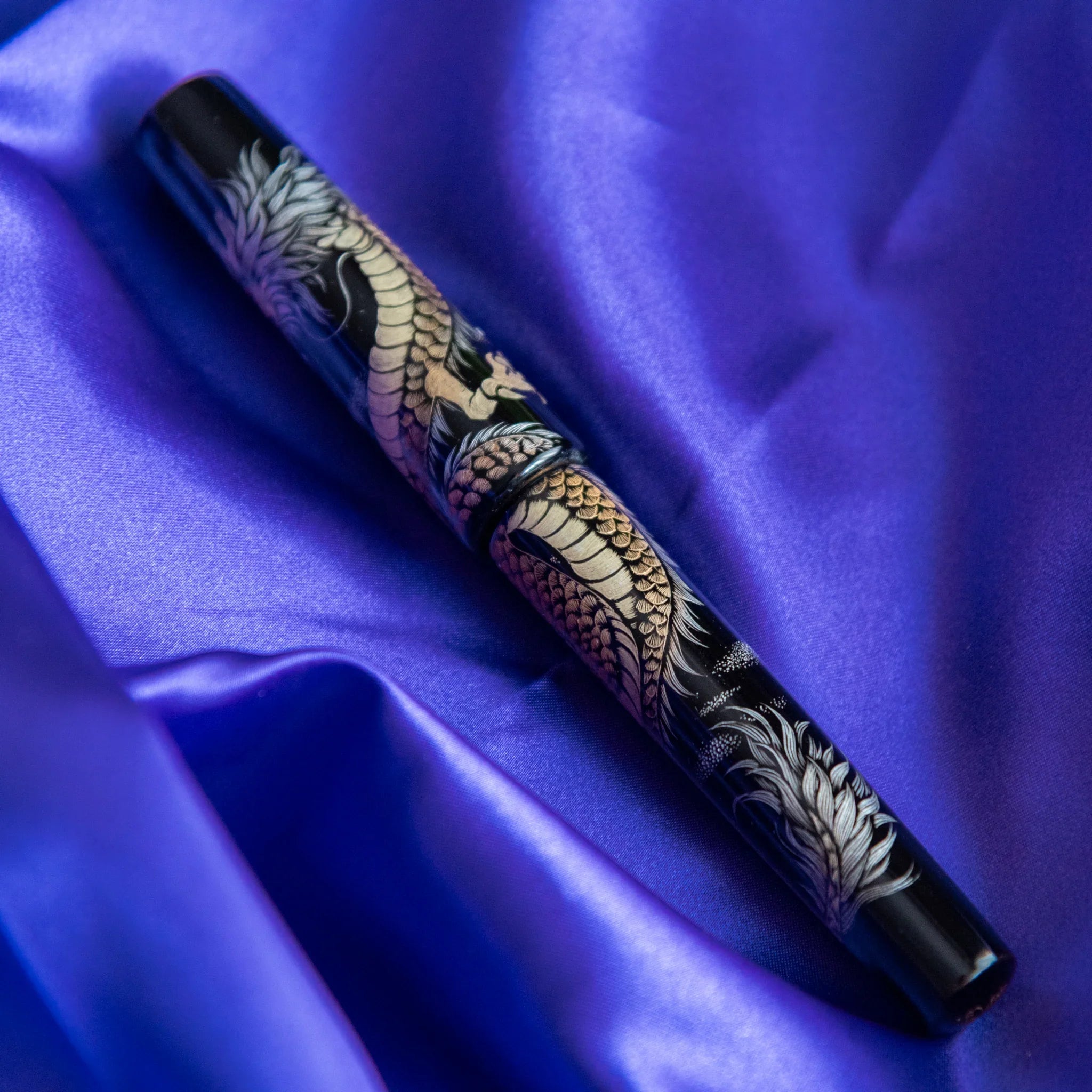 Chinkin Dragon pen with green silk cord tassel detail showing traditional Japanese styling showing product quality and des