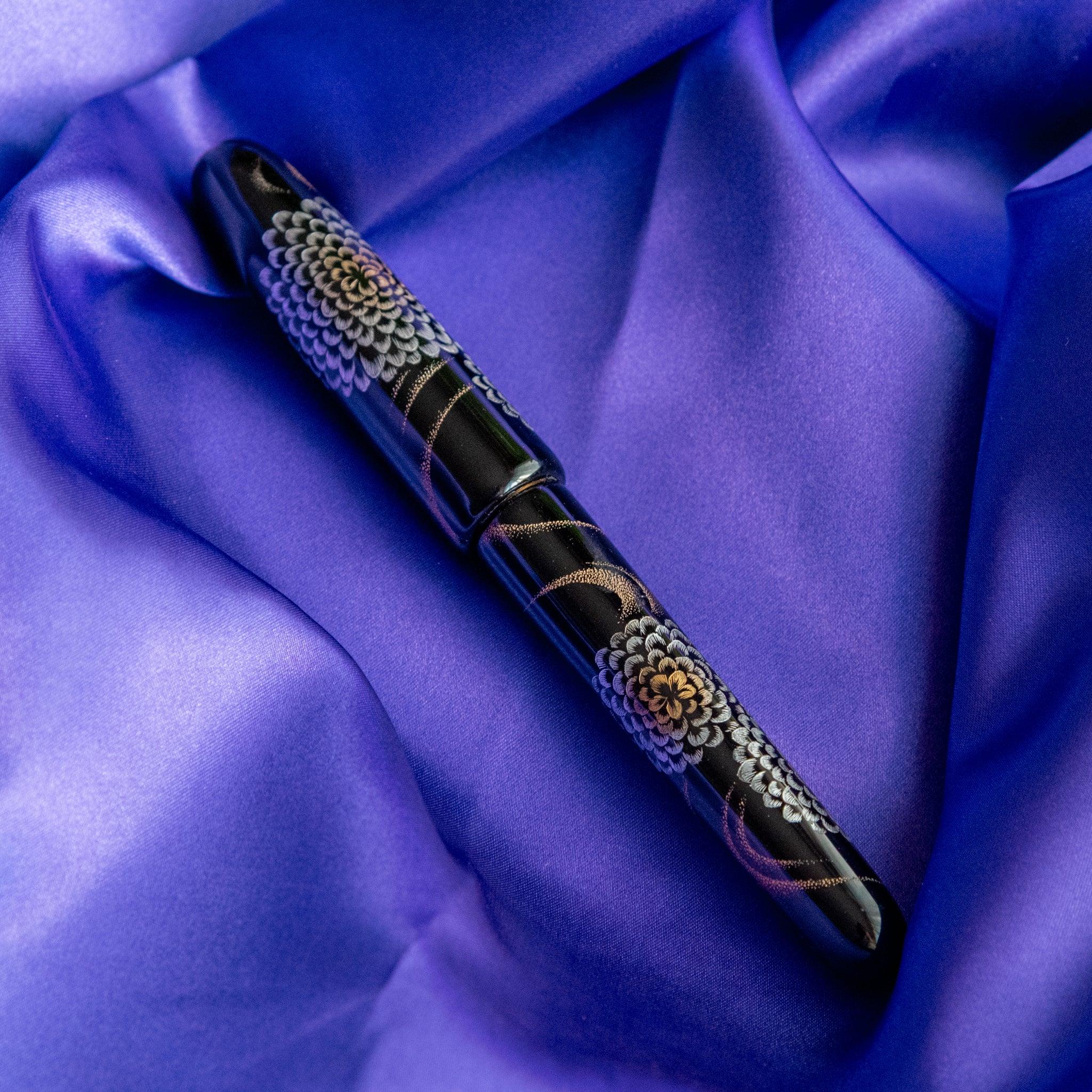 Chinkin Kikusui fountain pen with silk cord tassel showing traditional Japanese styling showing product quality and design