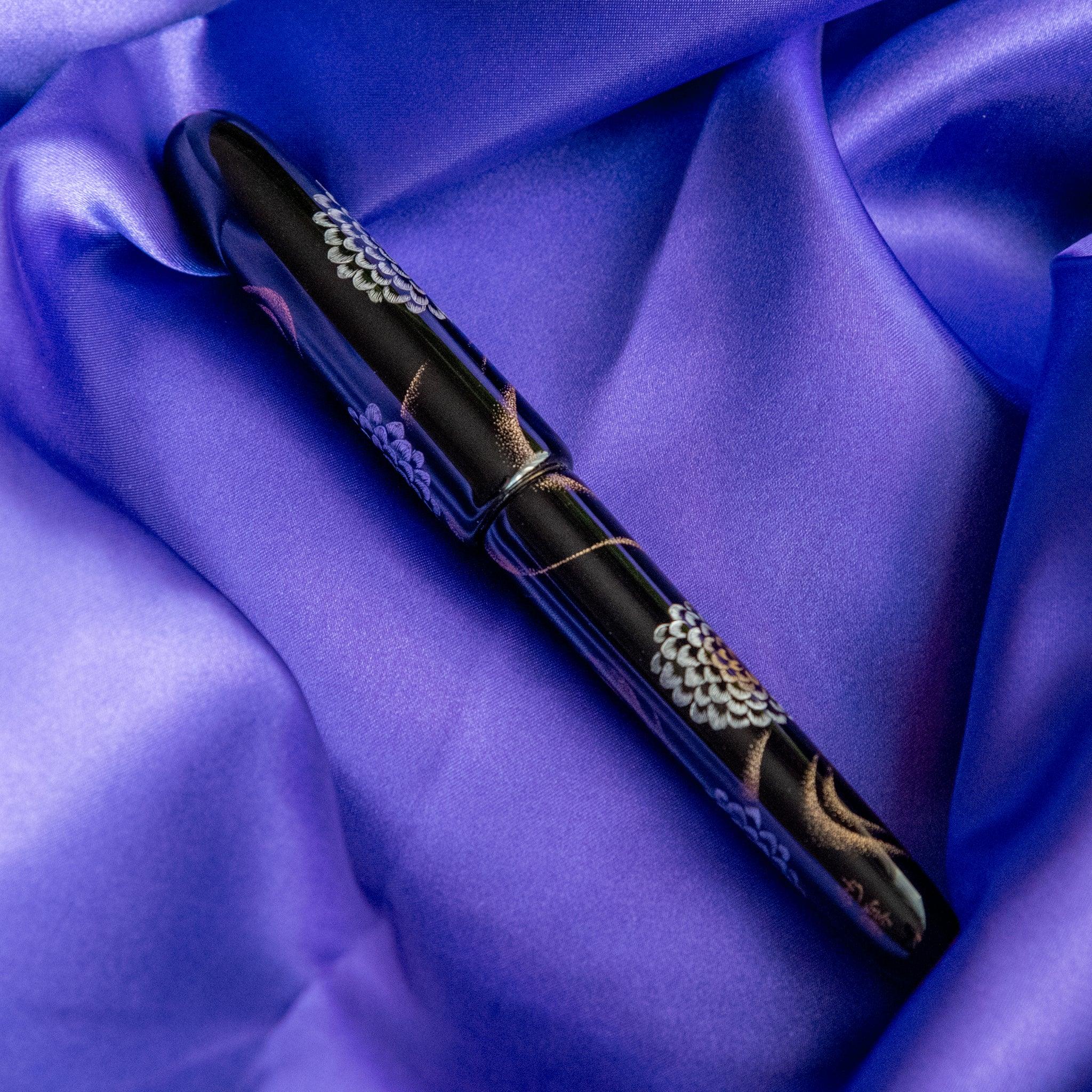 Nib detail of Chinkin Kikusui showing 14k gold nib and chrysanthemum lacquered barrel showing product quality and design d