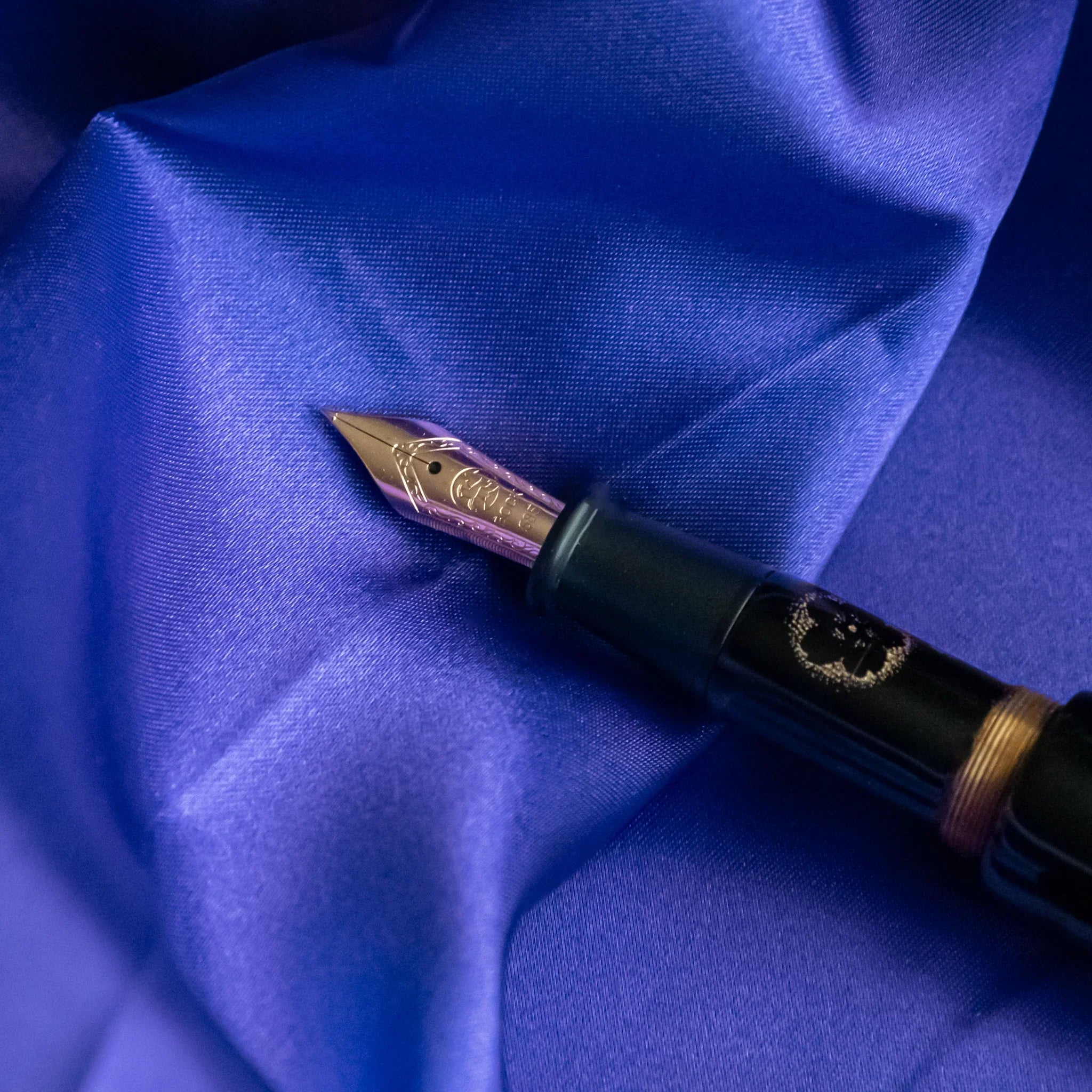 Detail of chinkin decoration showing sakura blossoms and Mount Fuji silhouette showing product quality and design details