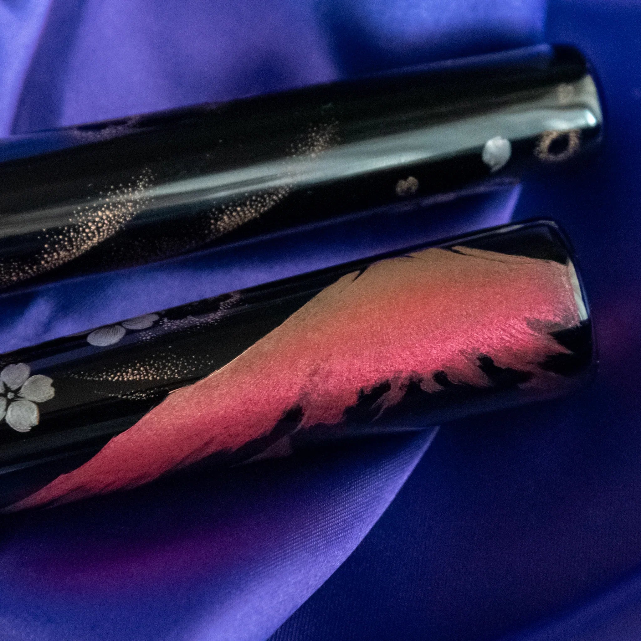 Nib detail of Chinkin Sakura and Fuji showing 14k gold nib and lacquered barrel showing product quality and design details