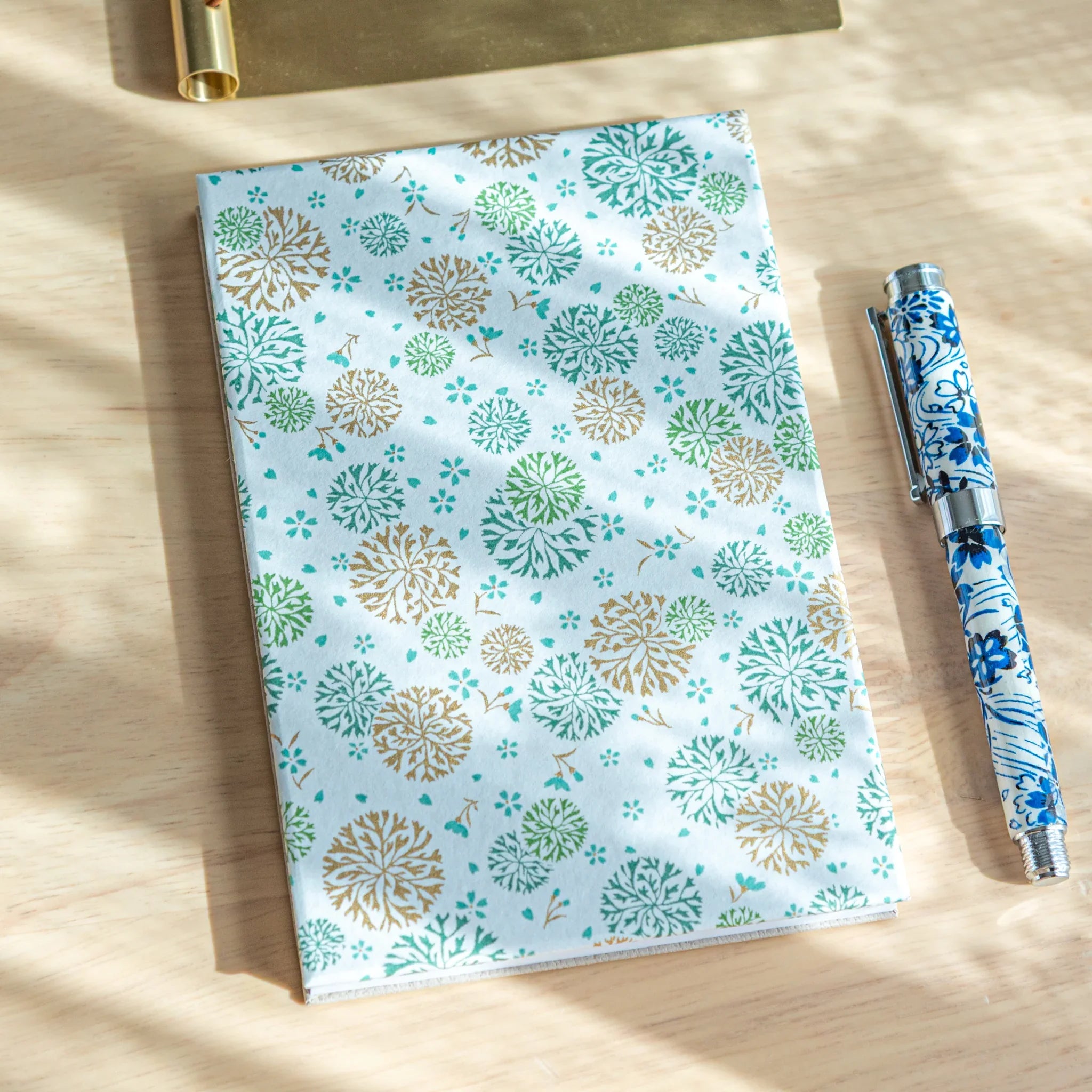 Chrysanthemum Harmony washi goshuincho stamp book with light blue cover featuring green and tan chrysanthemum flower print