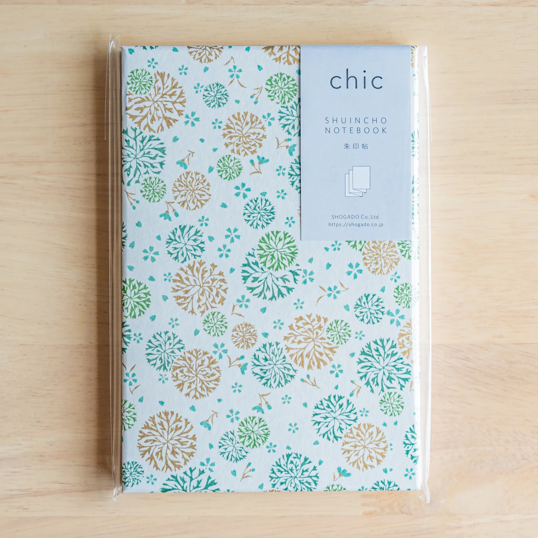 Chrysanthemum Harmony goshuincho shown at angle displaying spine binding and cover thickness with decorative chrysanthemum