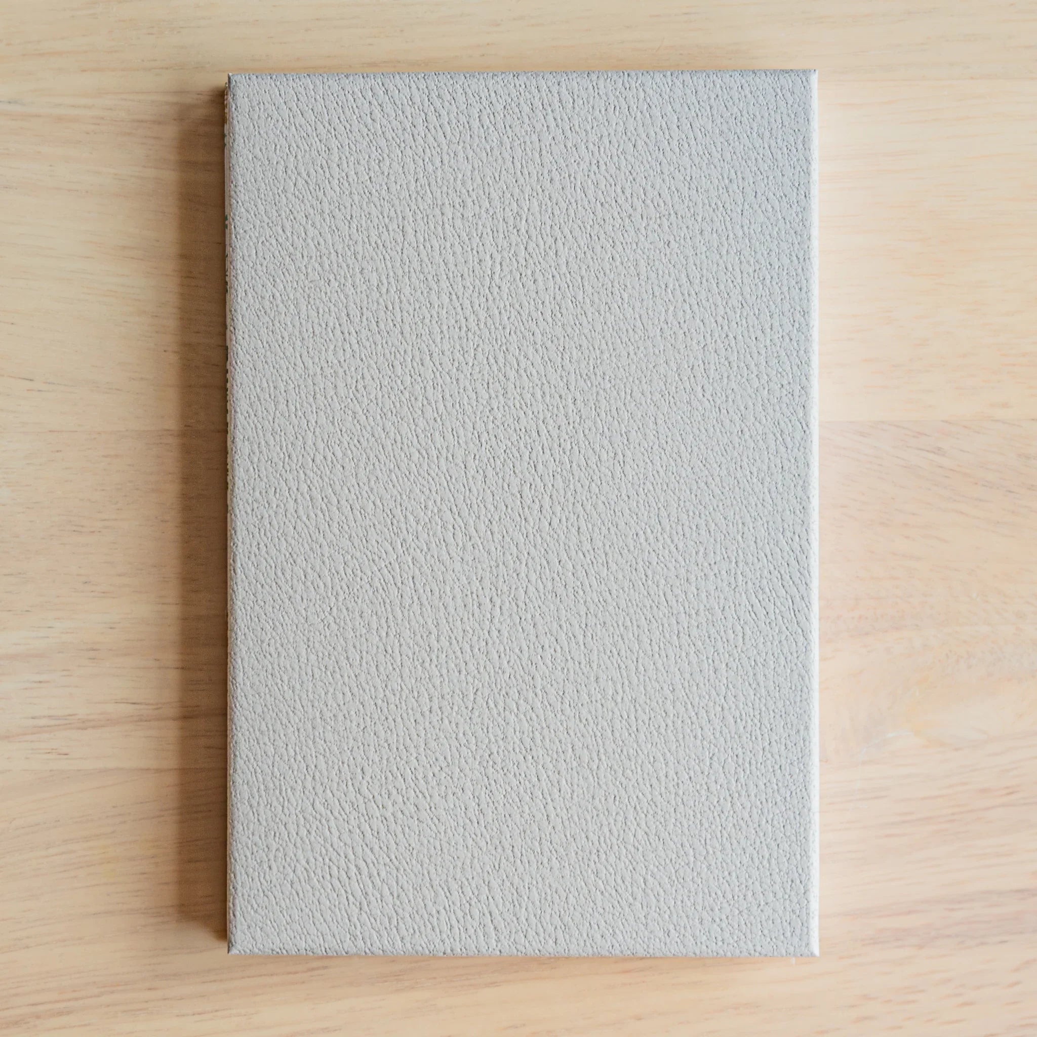 Pages of Chrysanthemum Harmony goshuincho fanned showing white paper quality and quantity ready for temple stamp collection